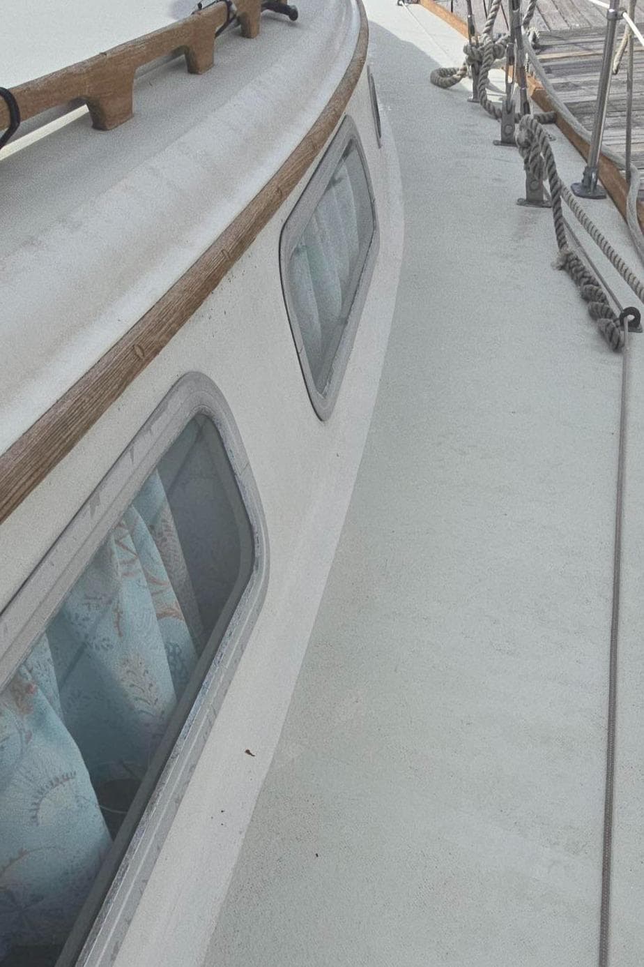 1977 Pearson 39 sailboat deck with windows and wooden trim.