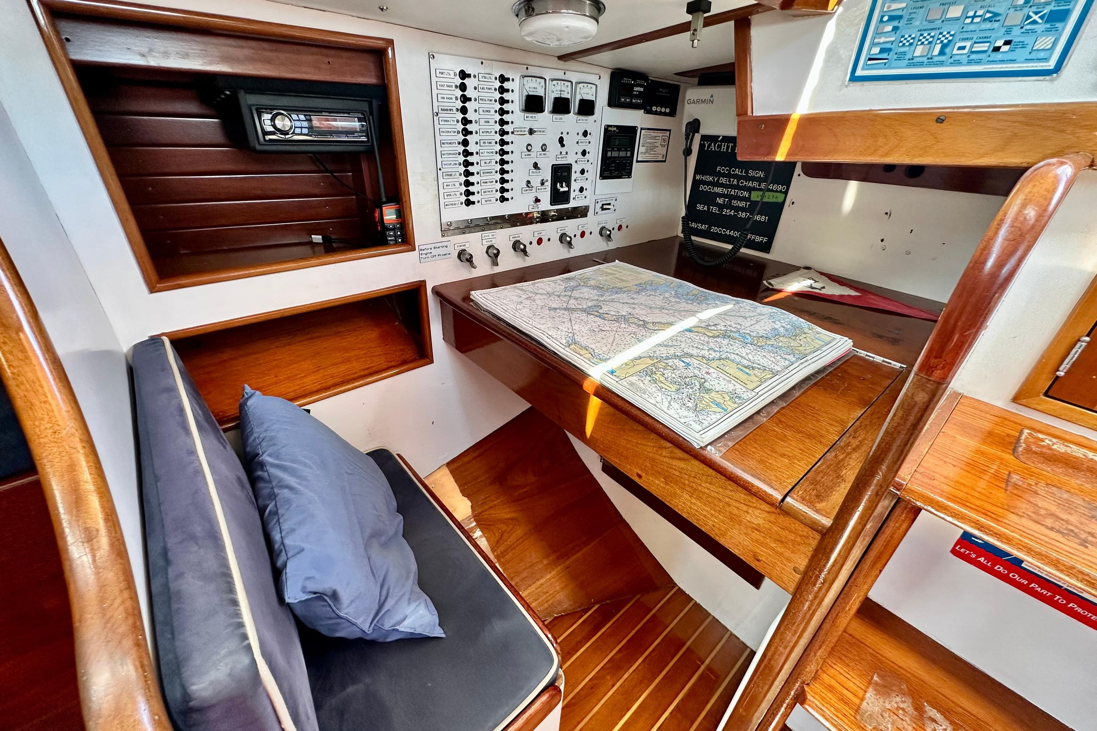 Navigation station of 1982 Hinckley Bermuda 40 MK III with chart and control panel.