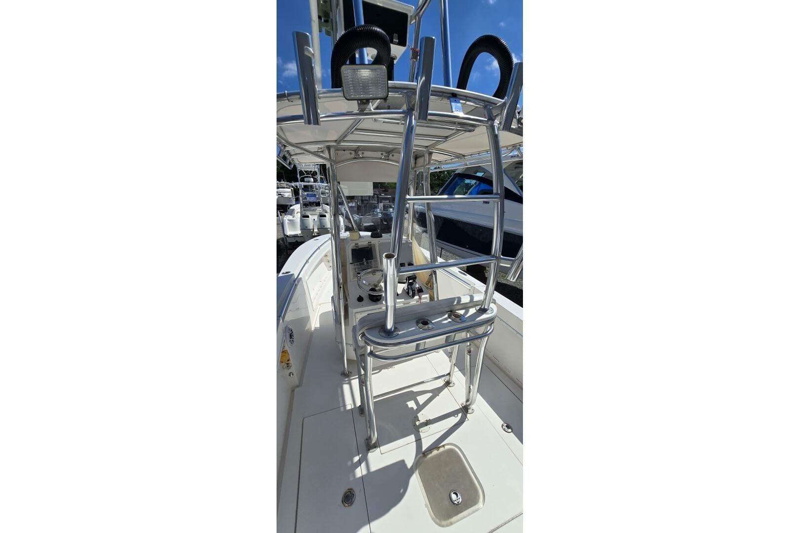 2008 Contender 23 Open boat interior with stainless steel fixtures and seating.
