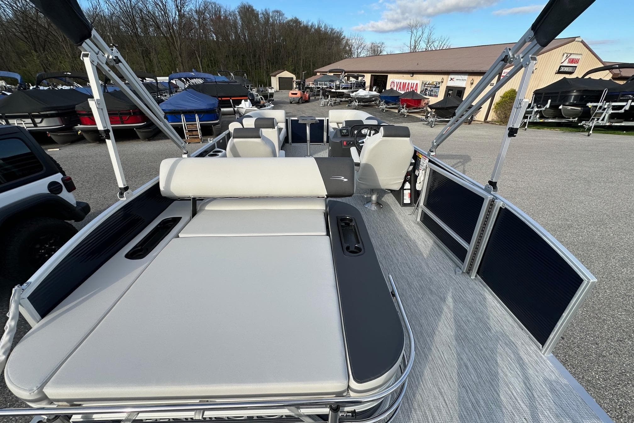 2026 Bennington 22 SSB SwingBack pontoon boat with Yamaha 90 Hp, in stock, outdoor display.