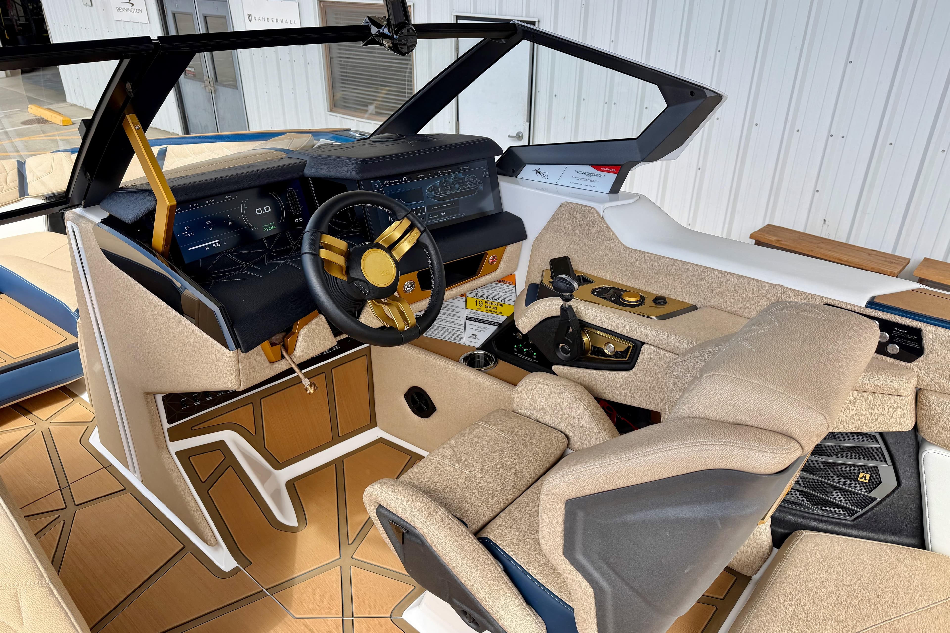 Interior of 2025 Nautique Super Air Nautique G25 Paragon boat, featuring modern dashboard and controls.