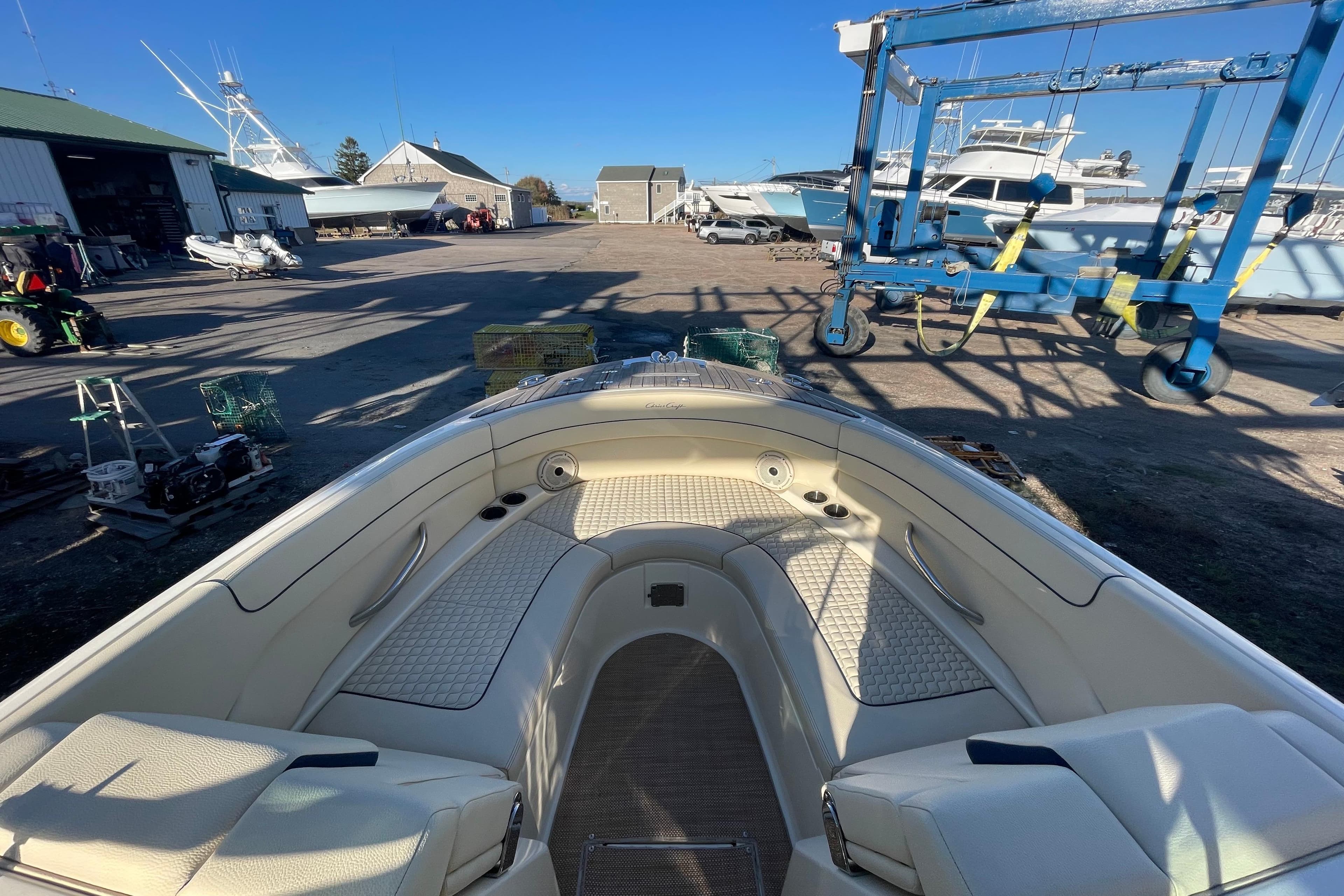 2020 Chris-Craft Launch 28 GT boat interior at a marina with equipment.