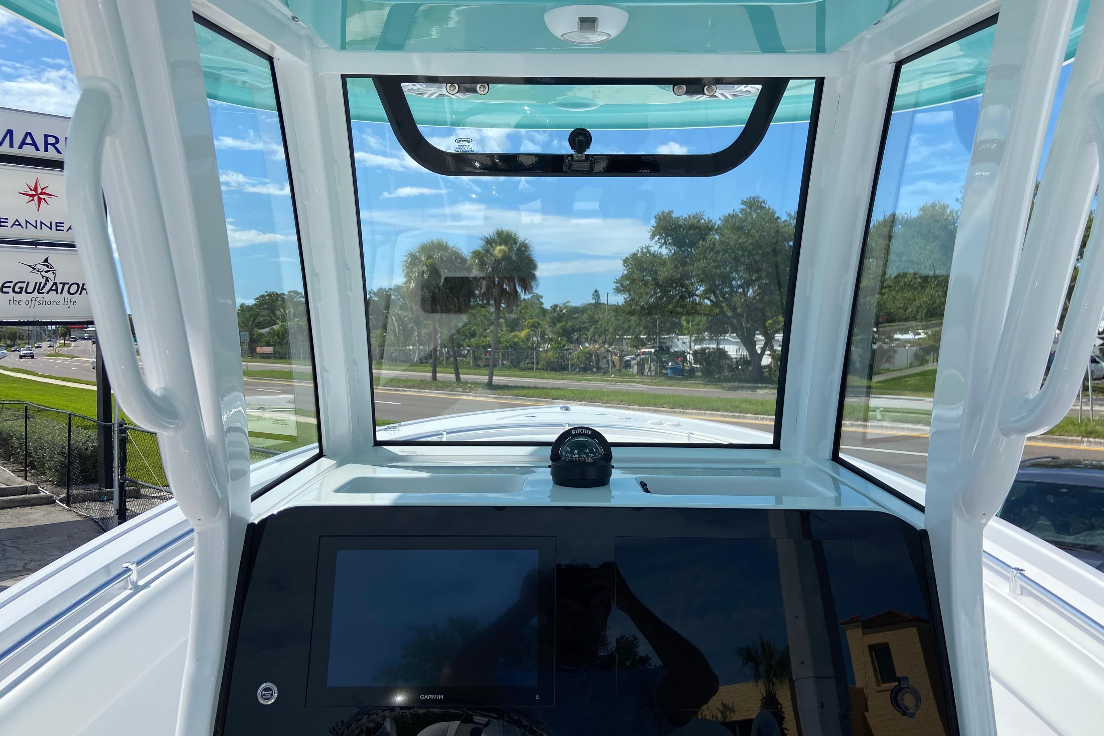 Interior view of 2026 Sportsman Open 252 Center Console boat with navigation equipment.