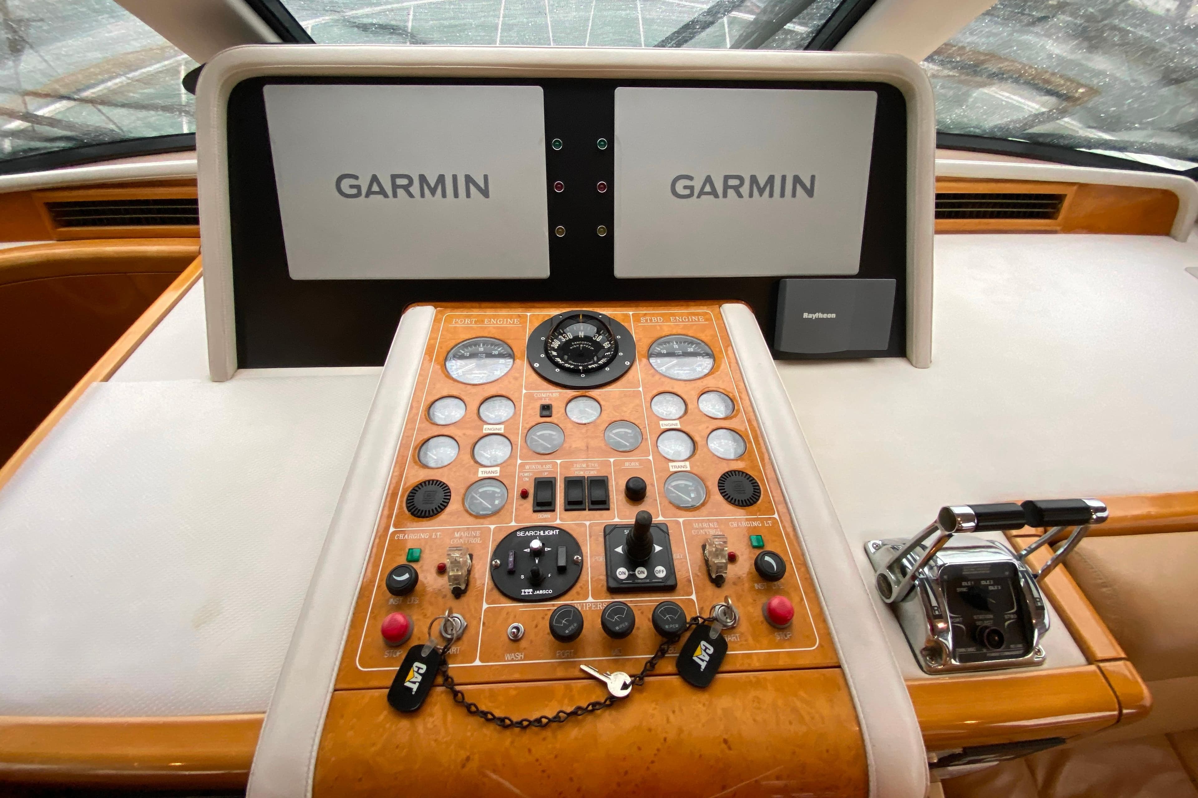 Control panel of a 2001 Compass 57 yacht with Garmin navigation displays.