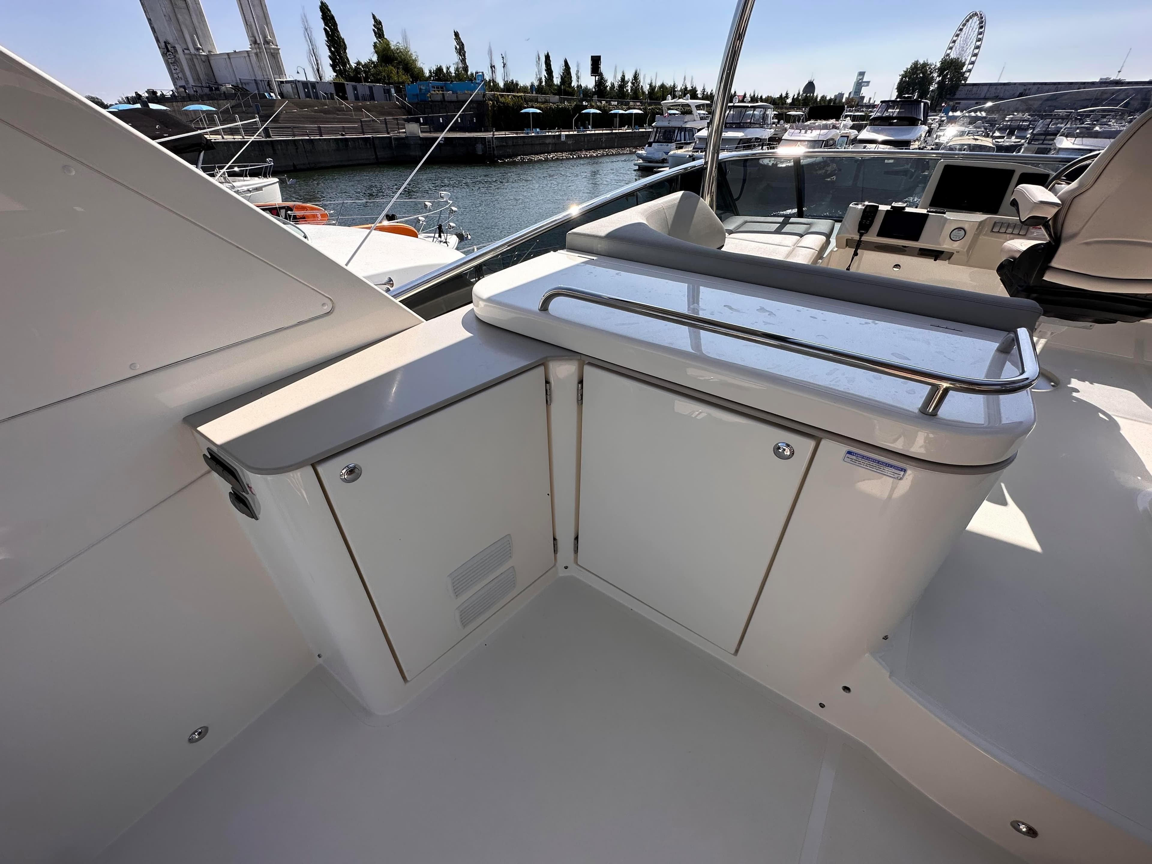 Absolute 52 Navetta 2022 yacht with modern deck features in harbor.