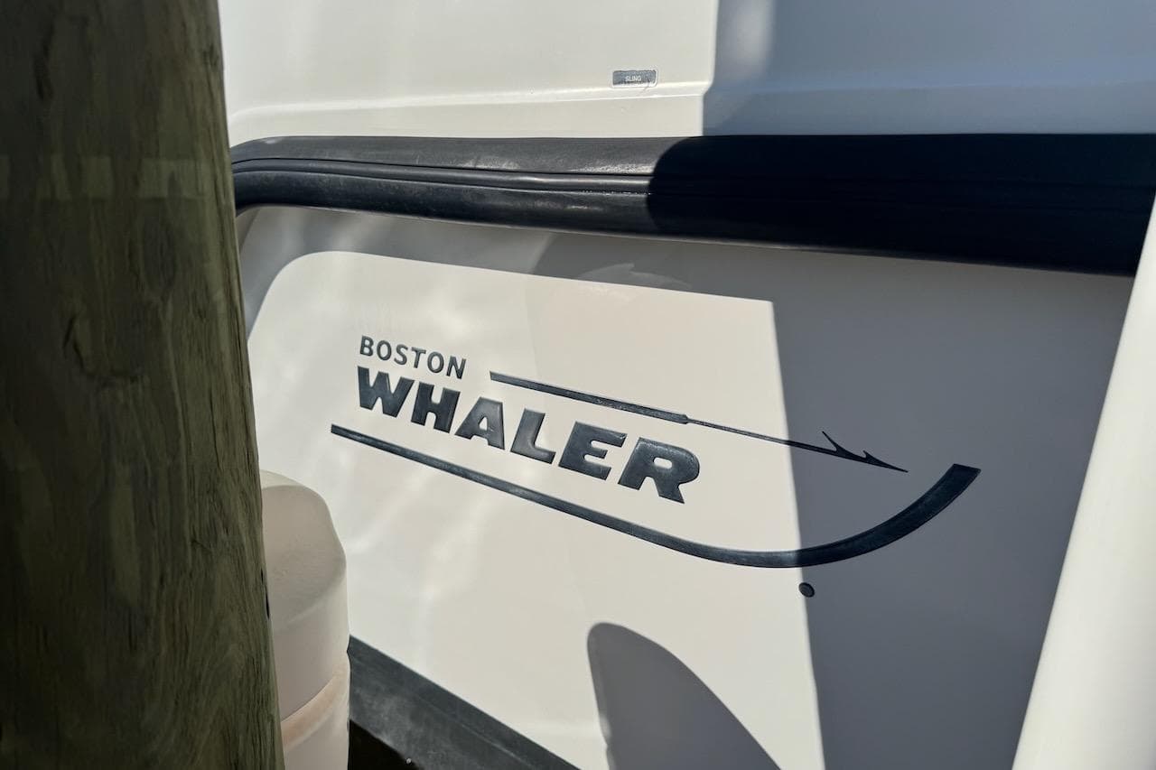 2014 Boston Whaler 315 Conquest boat logo on hull.