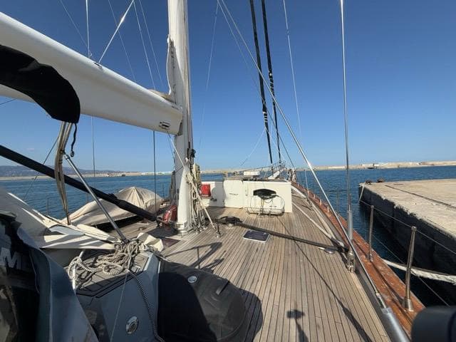 Custom Made 42 M Motorsailor, 2006, docked with clear blue sky and calm waters.