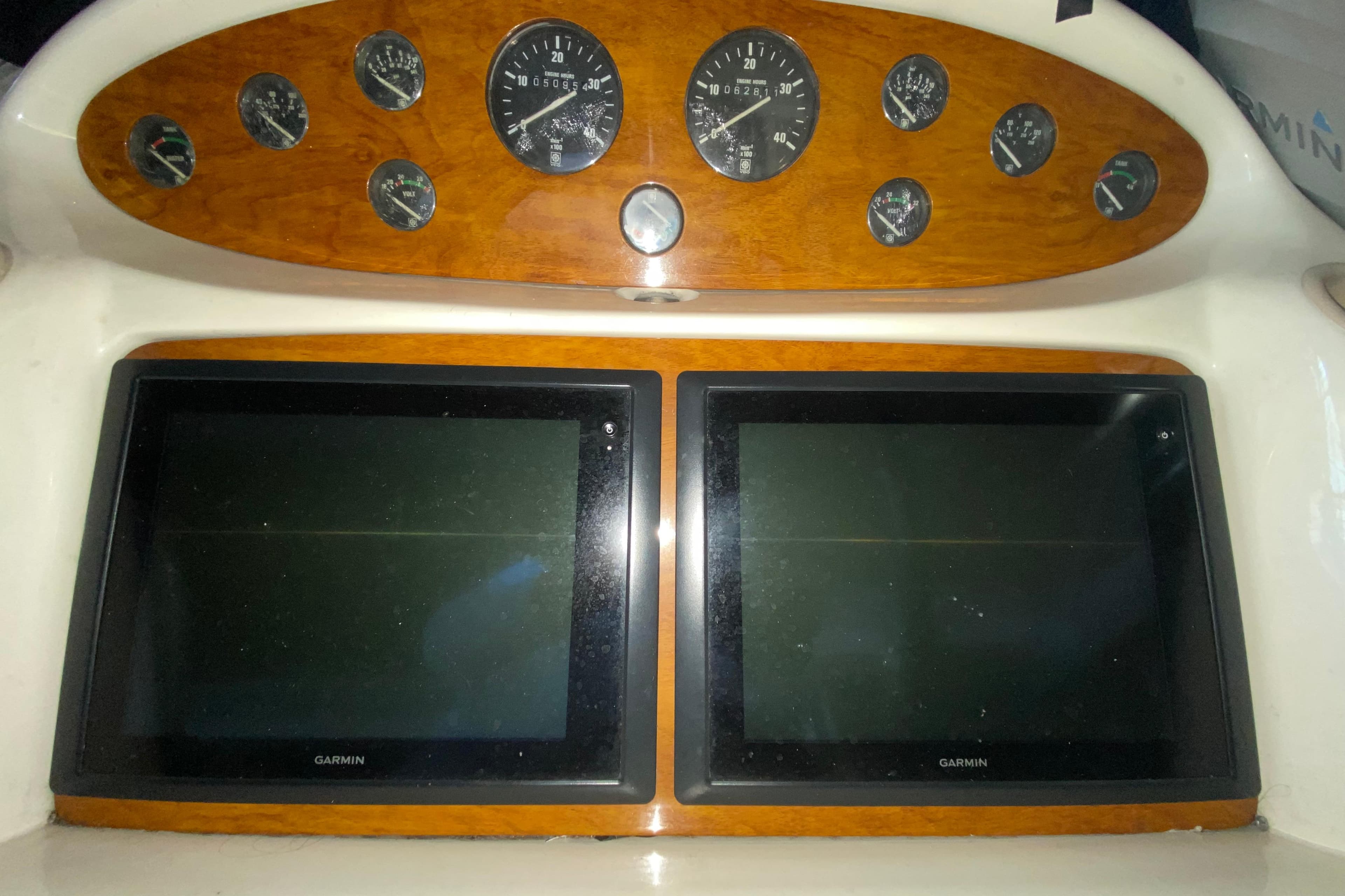 1997 Sunseeker Camargue 51 dashboard with Garmin displays and analog gauges.