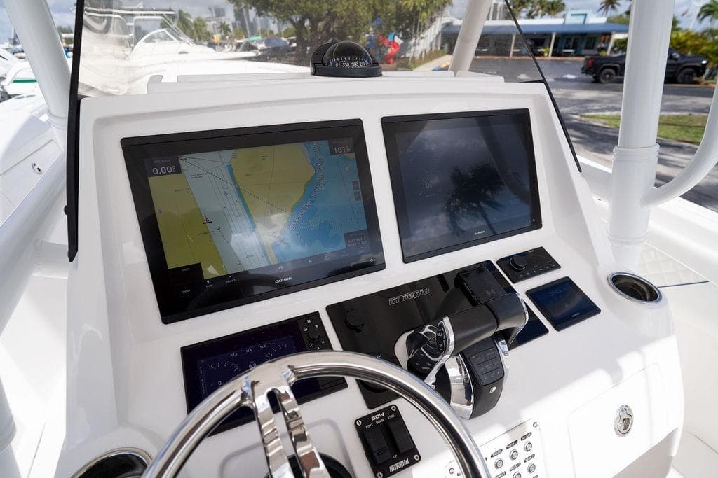 2022 Intrepid 345 Nomad FE boat dashboard with dual Garmin displays and controls.