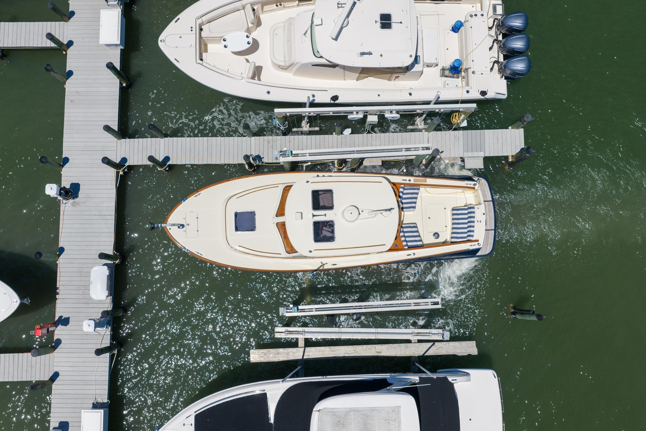 Aerial view of 2020 Hinckley Picnic Boat 34 MKII docked at marina.