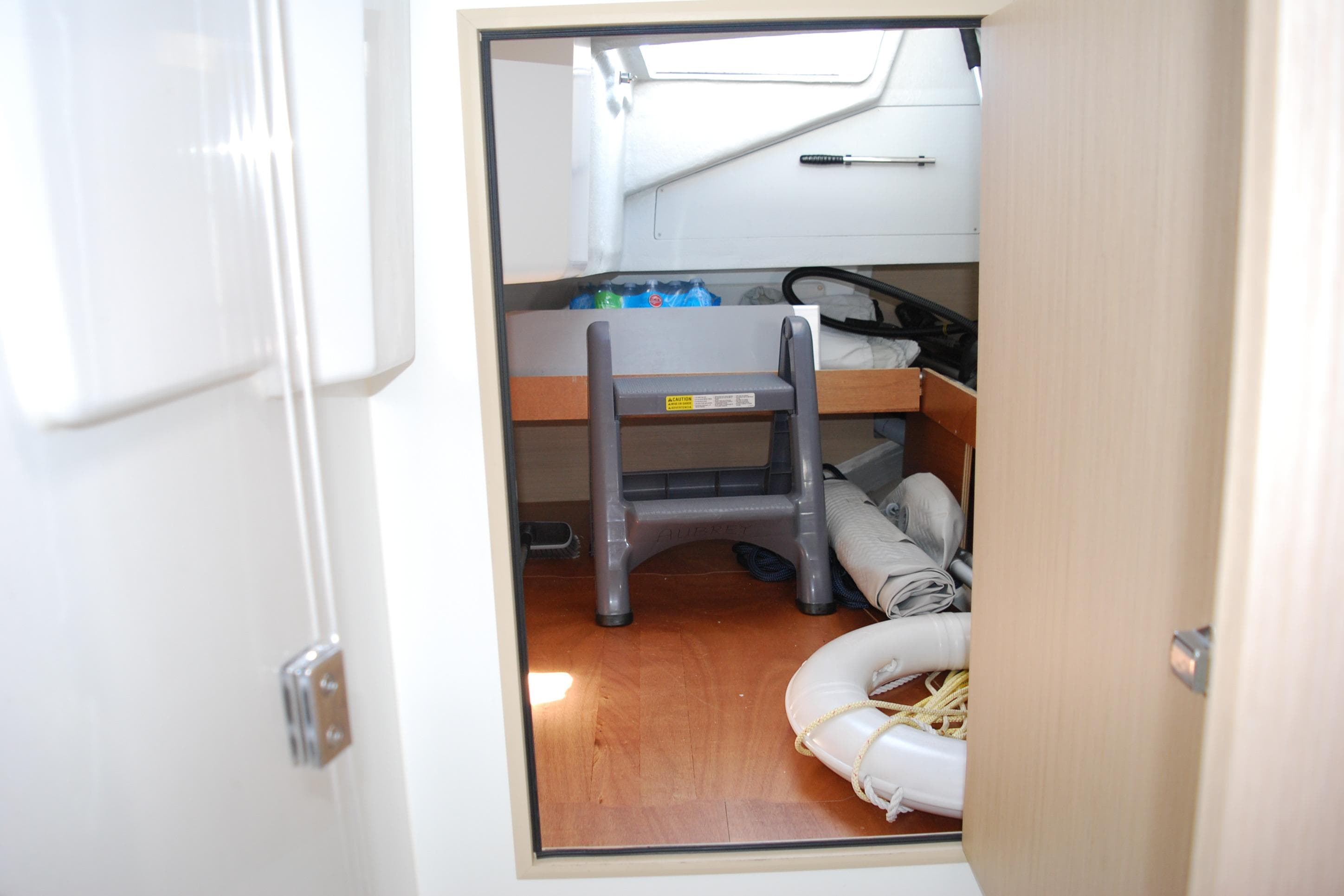 Interior storage area of 2023 Beneteau Oceanis 34.1 yacht with equipment and supplies.