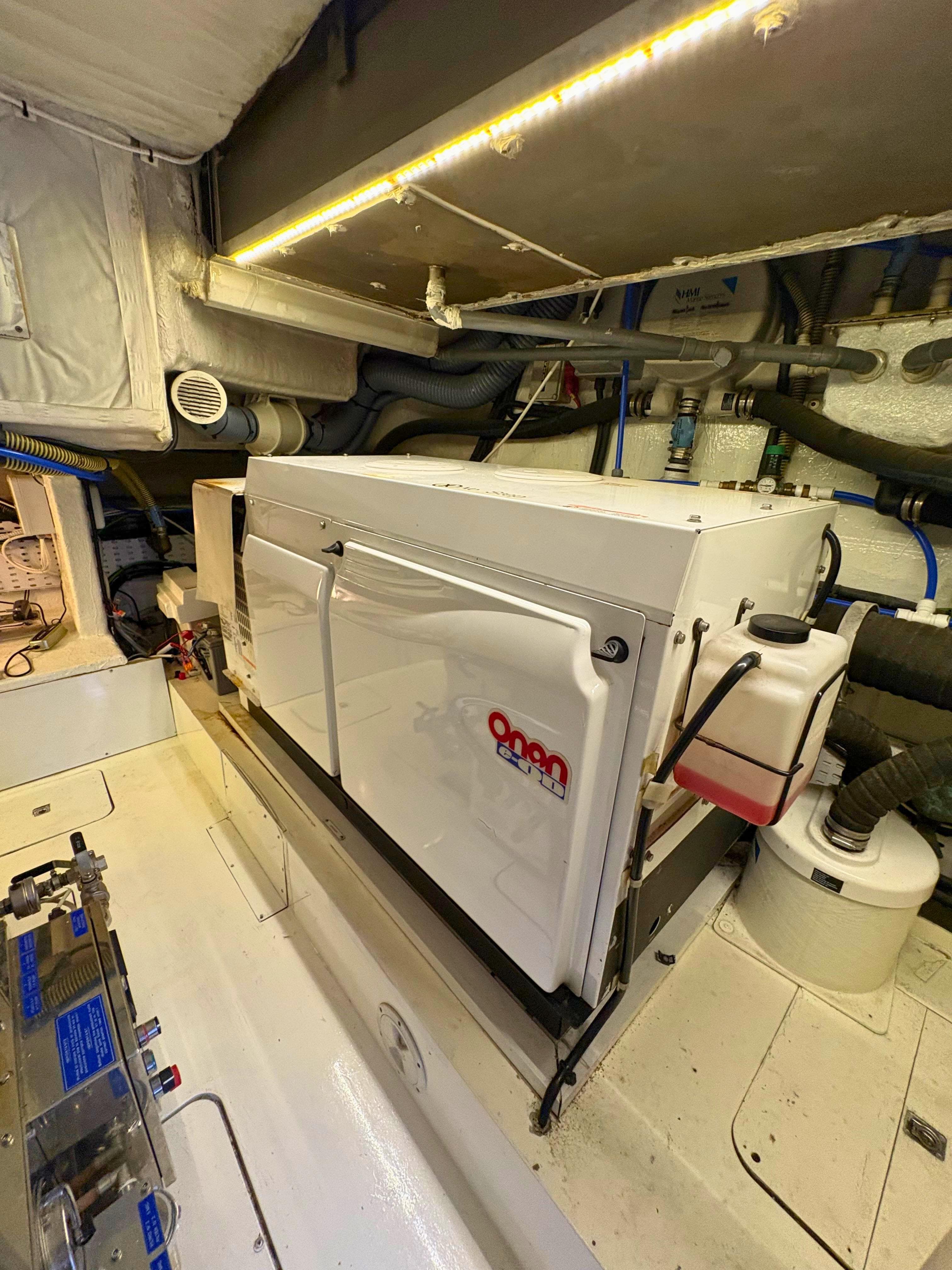 Engine room of 2007 Princess 21M yacht with Onan generator and mechanical components.