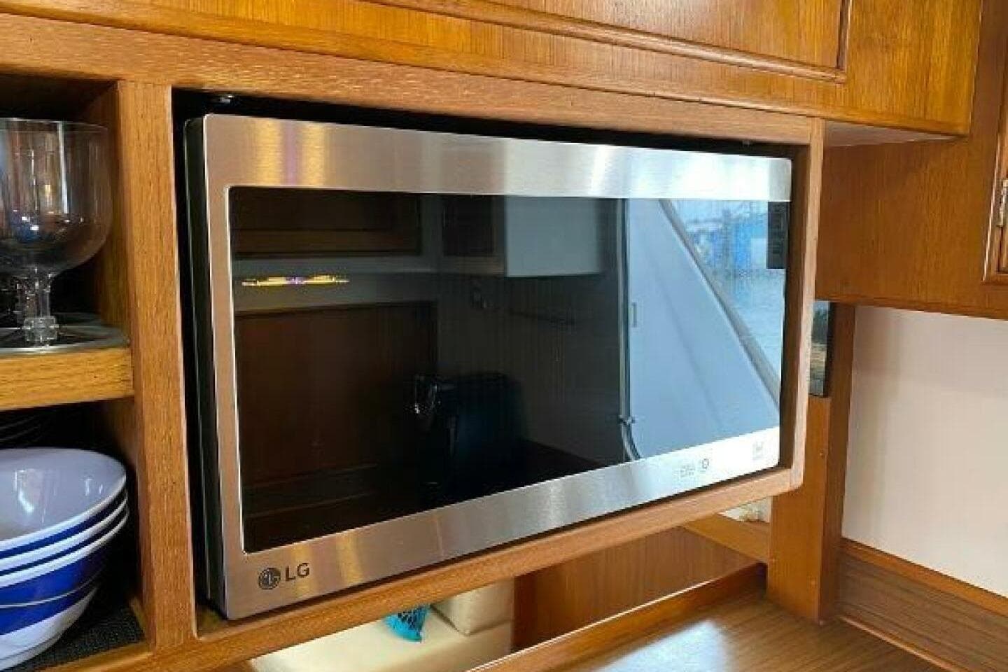 LG microwave in wooden kitchen of 1973 Grand Banks 49 Alaskan yacht.