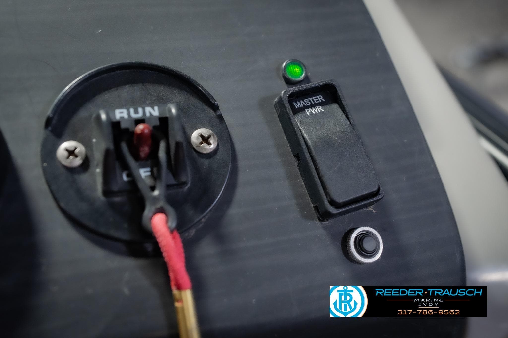 Control panel of 2022 Bennington 23 QXFBA boat with master power switch.