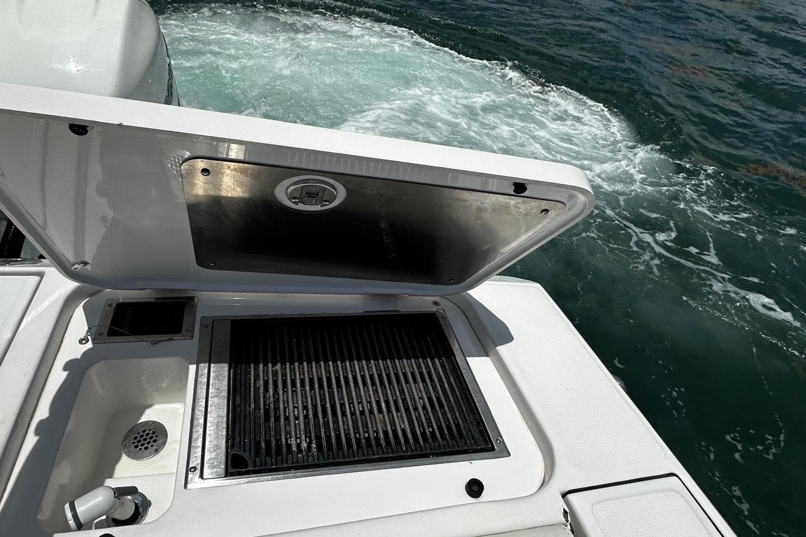 2022 Bertram 39 CC boat with open grill and ocean view.