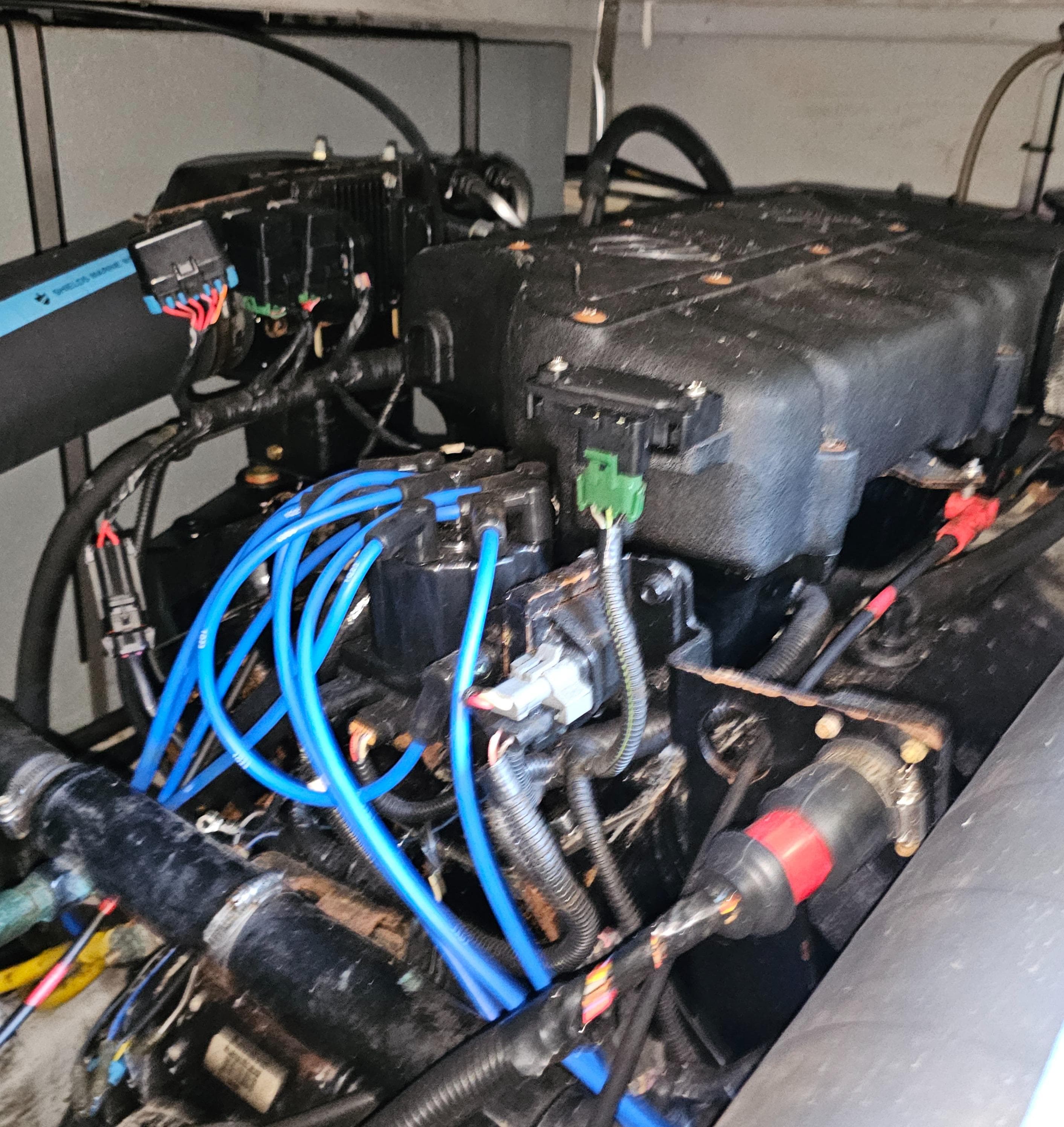 Engine compartment of a 2000 Silverton 392 Motor Yacht with visible wiring and components.