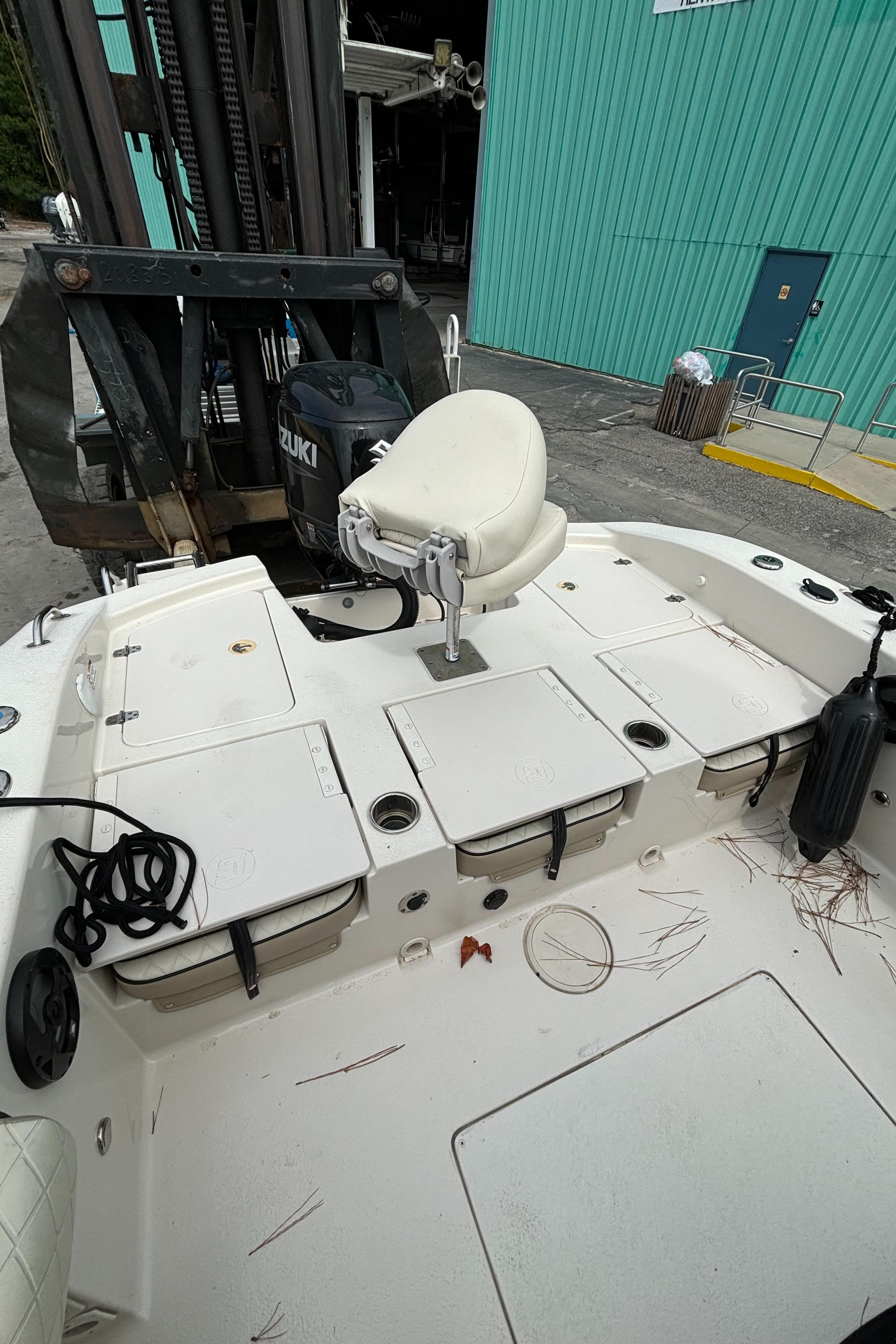2021 Carolina Skiff 24 Ultra Elite boat deck with seating and storage compartments.