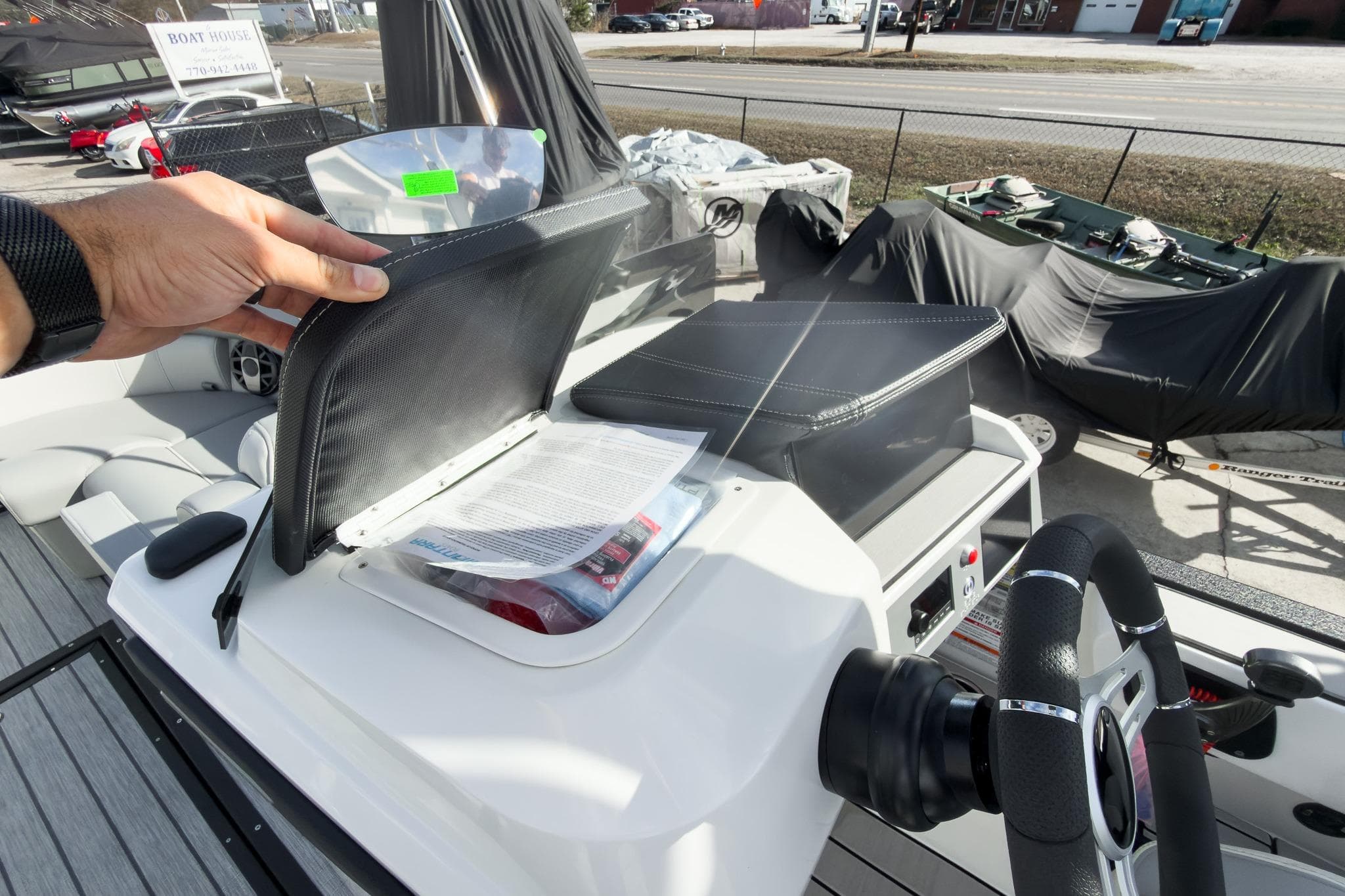 2026 Montara Surf Boss 2.0 SL 23" boat dashboard with storage compartment open.