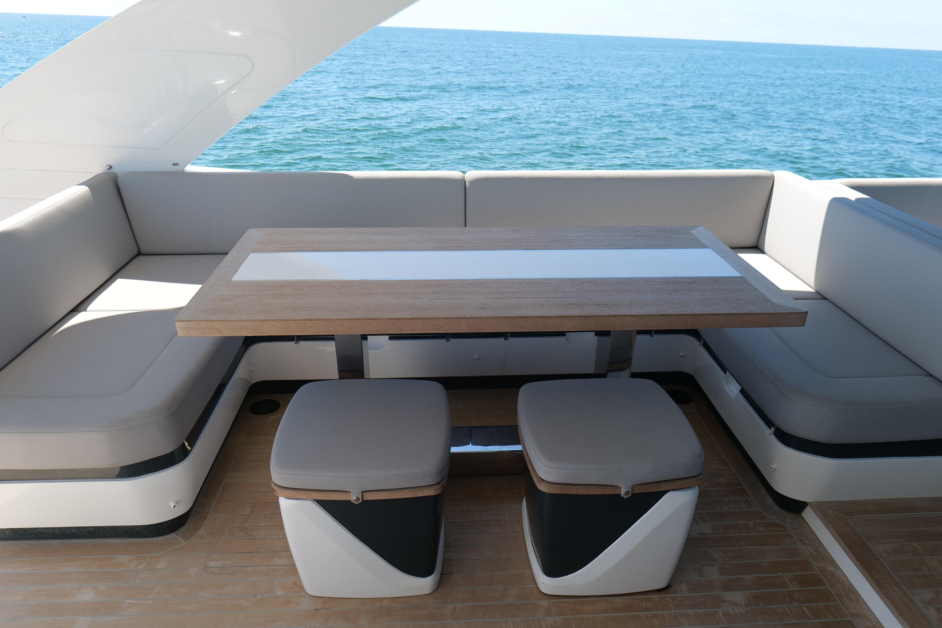 Luxurious seating area on 2022 Pearl 62 yacht with ocean view.