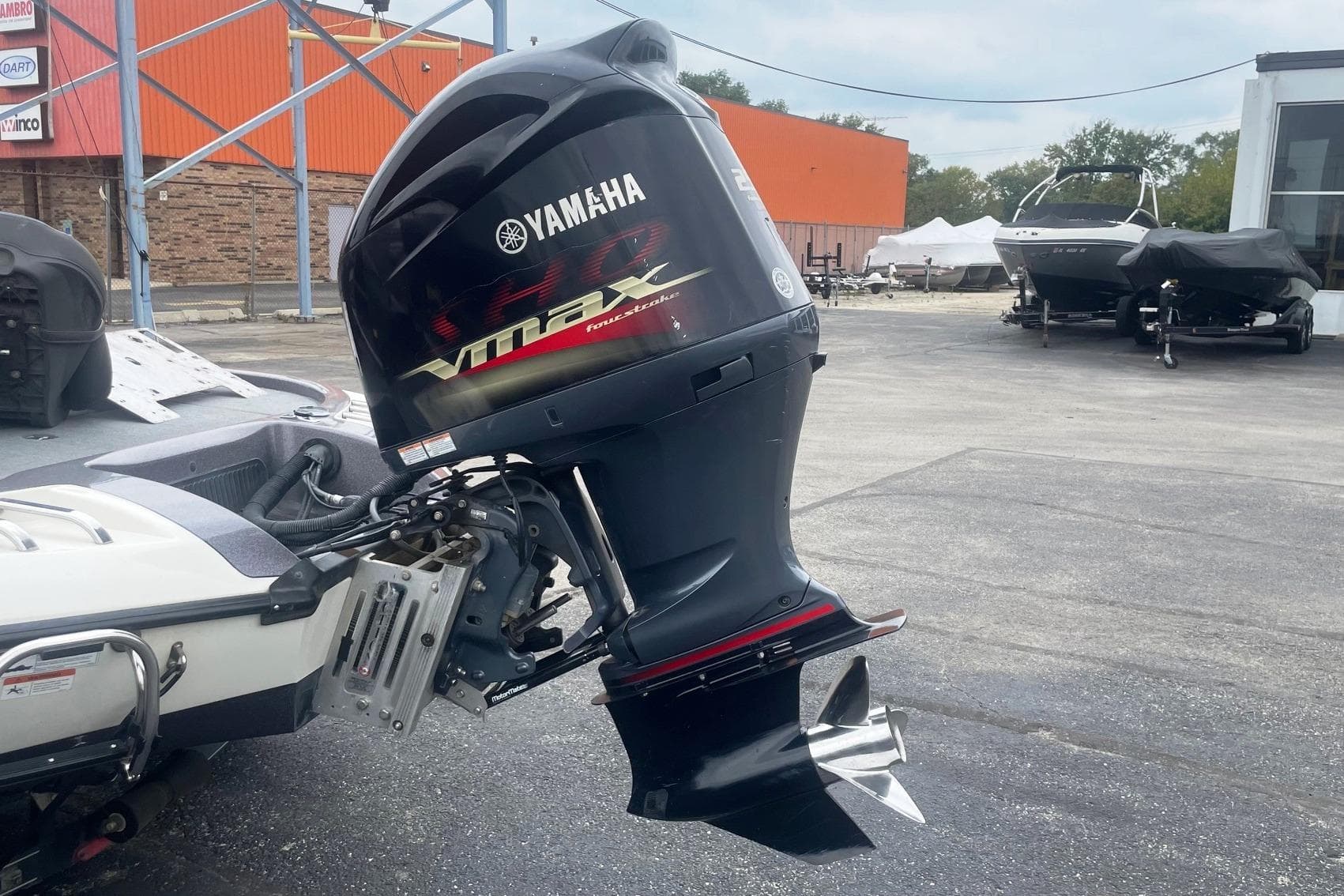 2010 Ranger Z520 Comanche with Yamaha VMAX outboard motor in a parking lot.