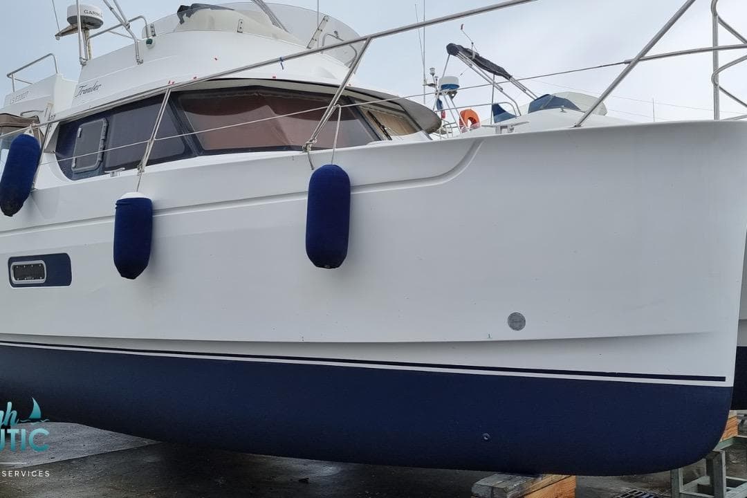 2008 Fountaine Pajot HIGLAND 35 catamaran with blue fenders, docked on land.