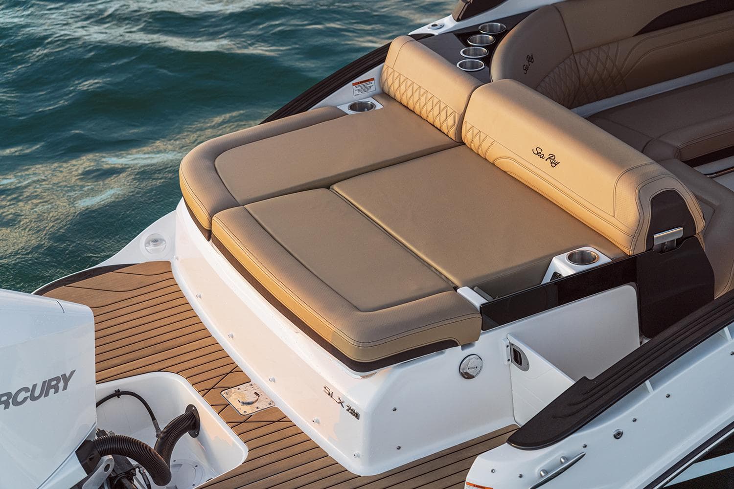 2023 Sea Ray SLX 260 Outboard boat with luxurious tan seating on the water.