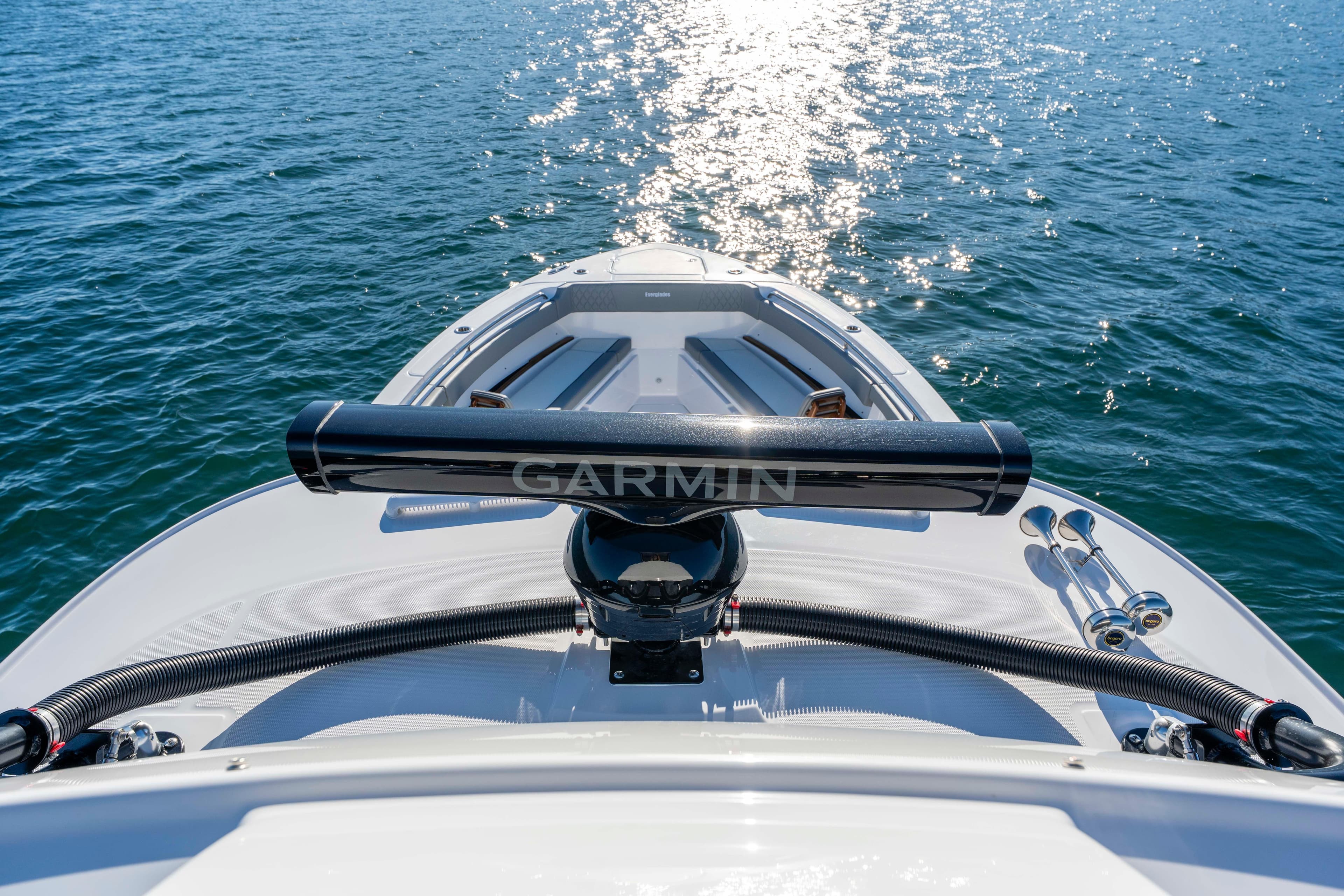 Everglades 455 Center Console 2026 on water with Garmin equipment.