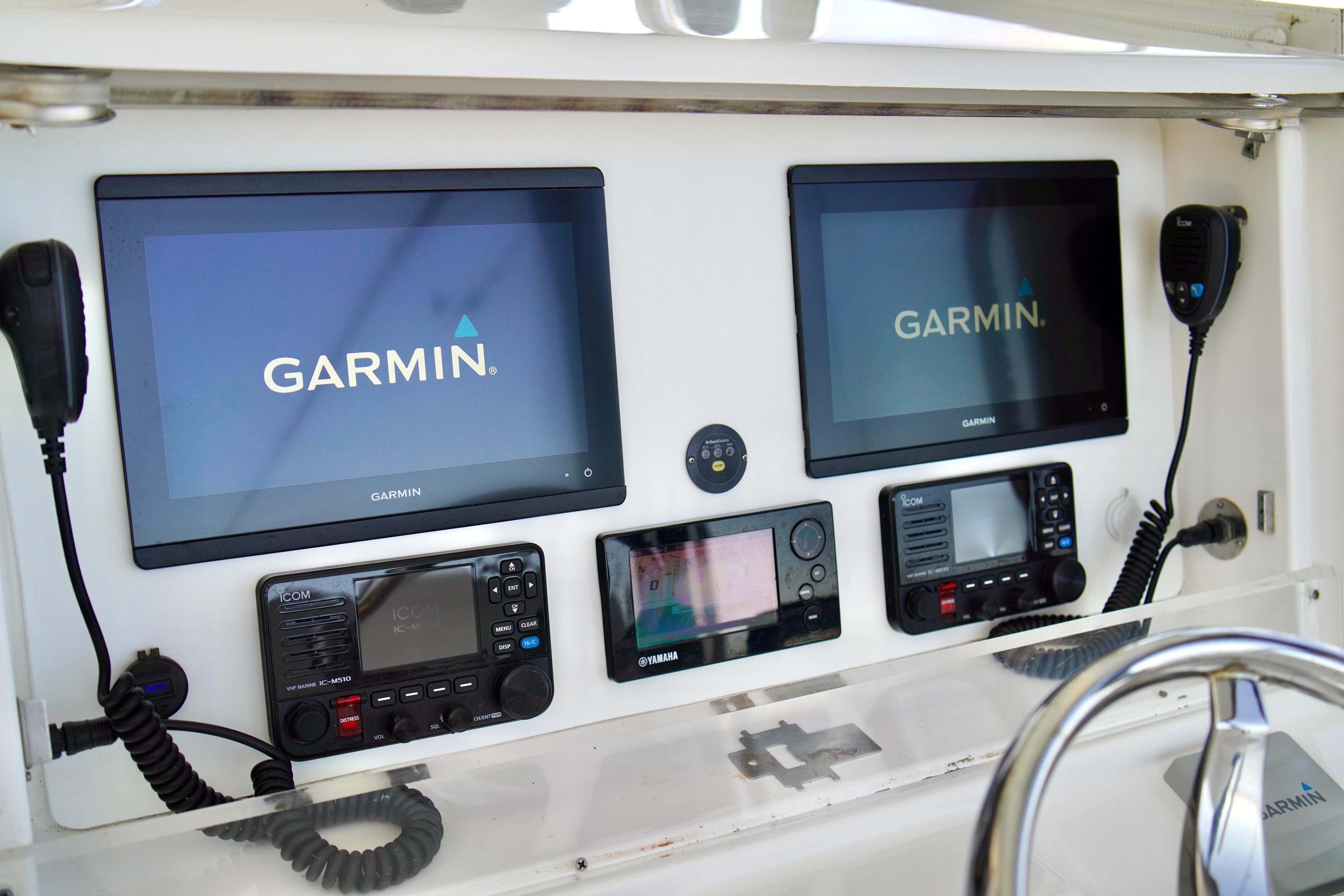 2019 Invincible 36 Open Fisherman dashboard with Garmin navigation displays and communication equipment.