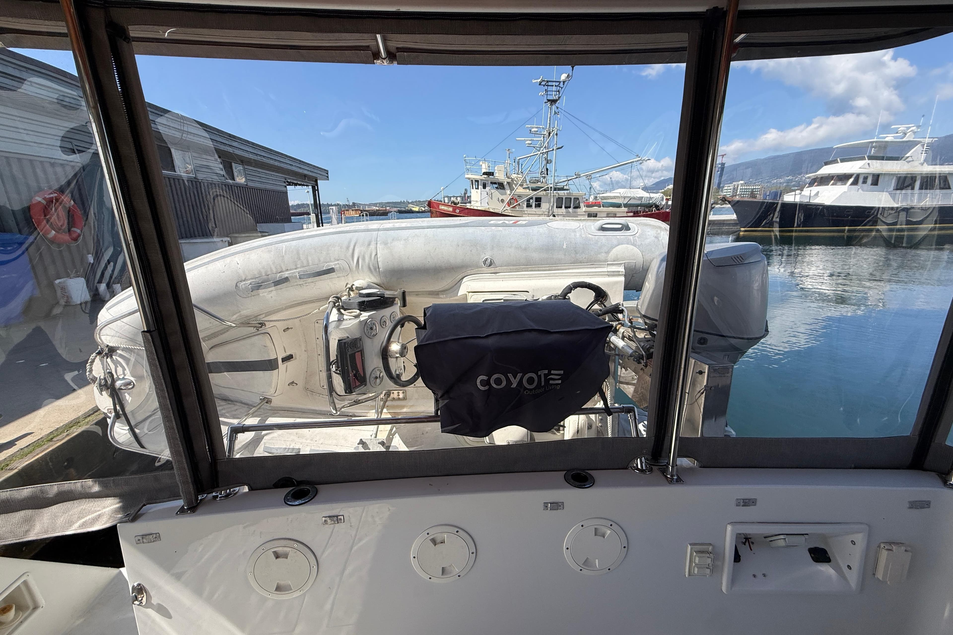 View from a 1996 Carver 370 Voyager, overlooking docked boats and a marina.