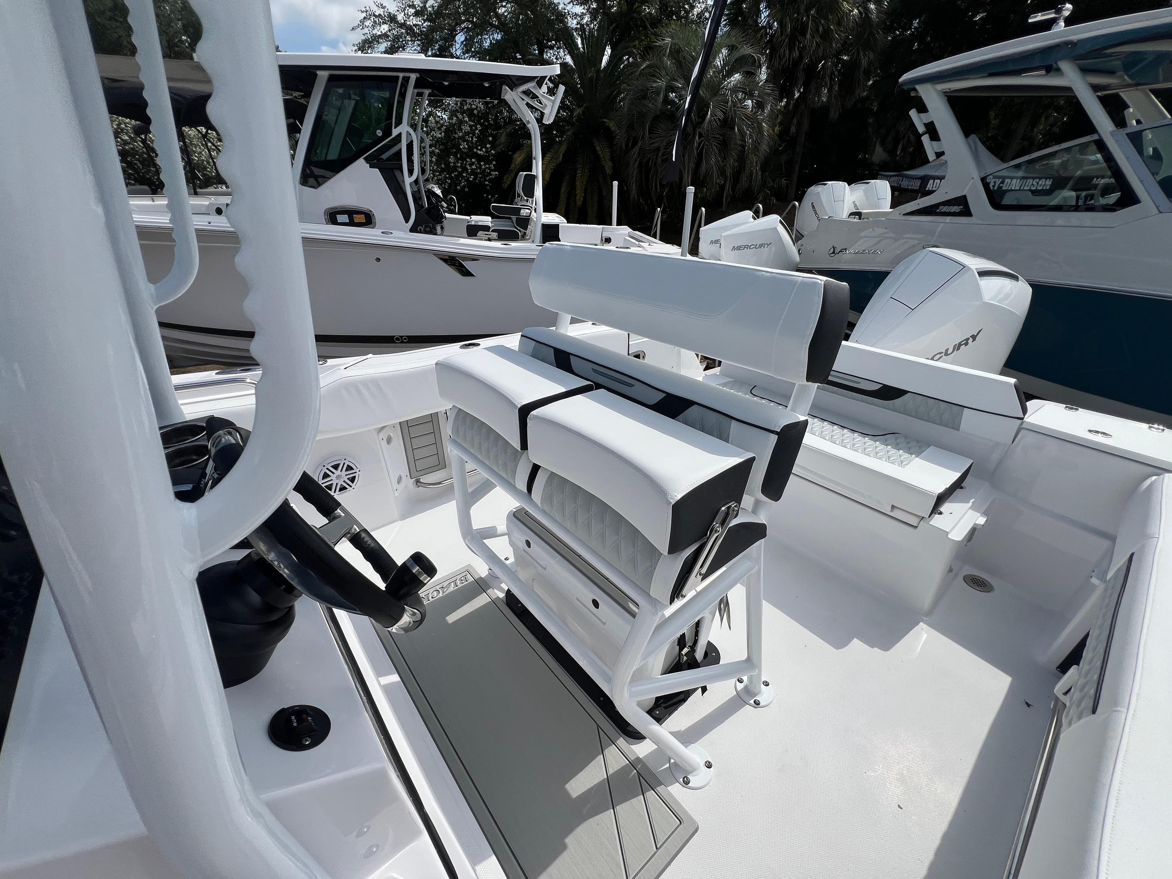 2025 Blackfin 222 CC boat interior with seating and control console.