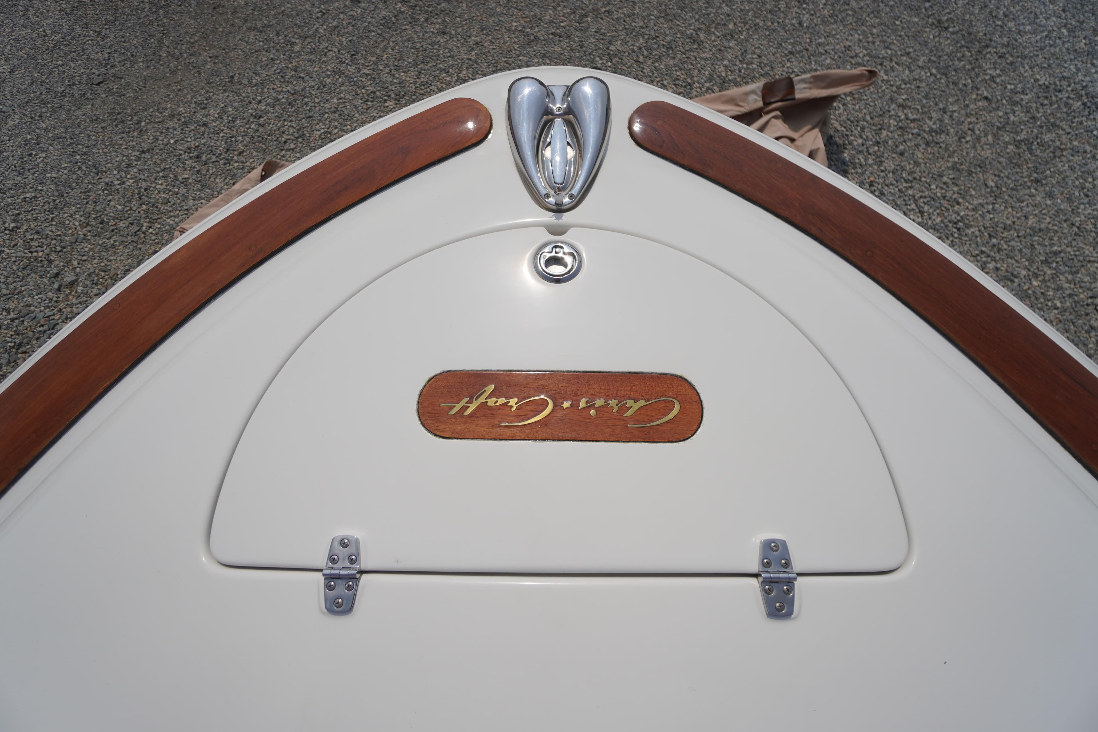 2007 Chris-Craft Corsair 28 boat deck with wood accents and logo detail.
