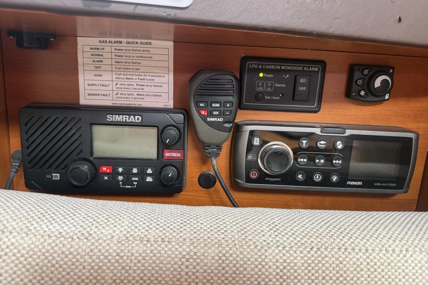 Control panel with Simrad radio and Fusion audio system on a 2013 Hanse 415 yacht.