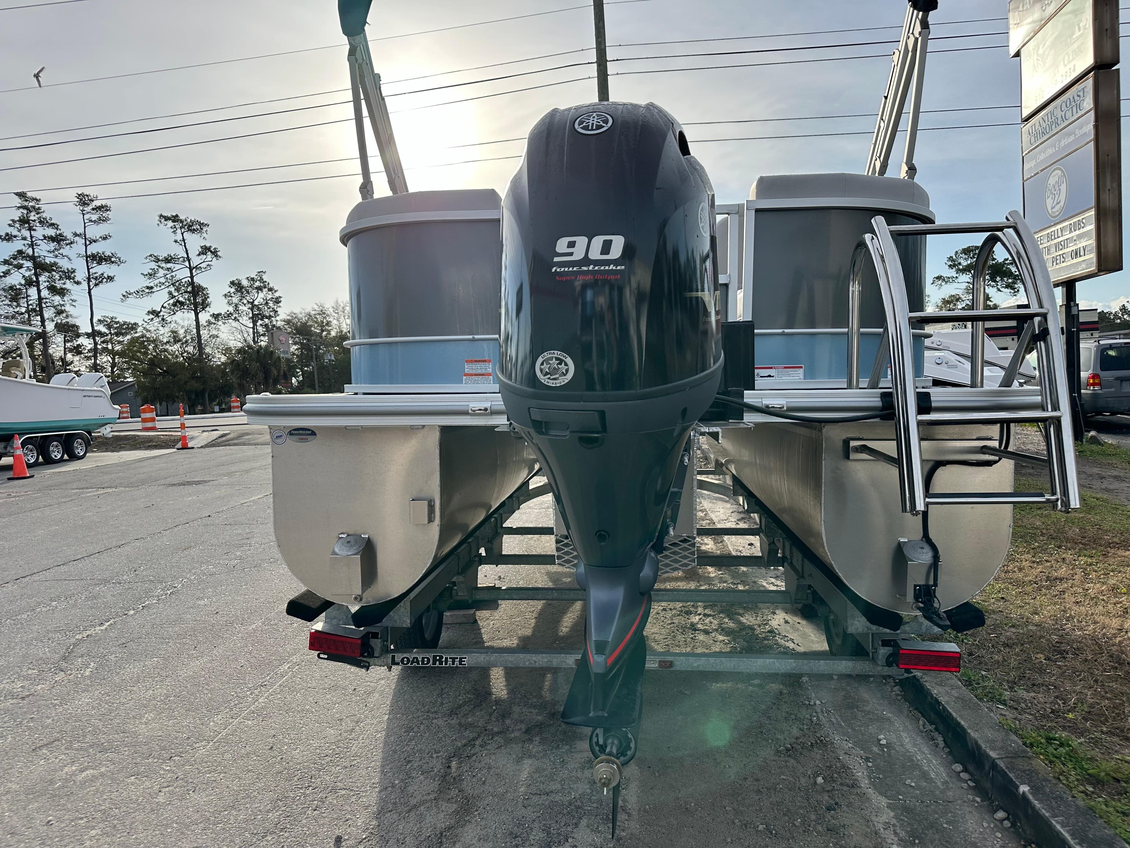2024 SunCatcher Select 20RC pontoon boat with 90 horsepower outboard motor.