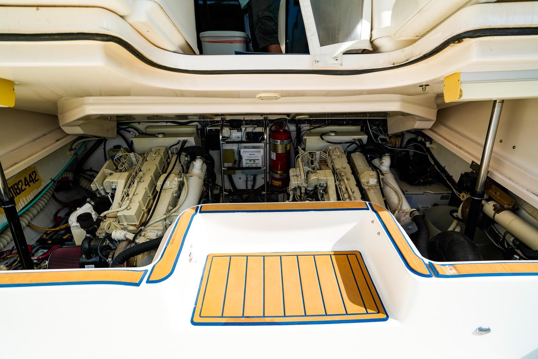 Engine compartment of a 2005 Tiara Yachts 3800 Open, showcasing dual engines and equipment.