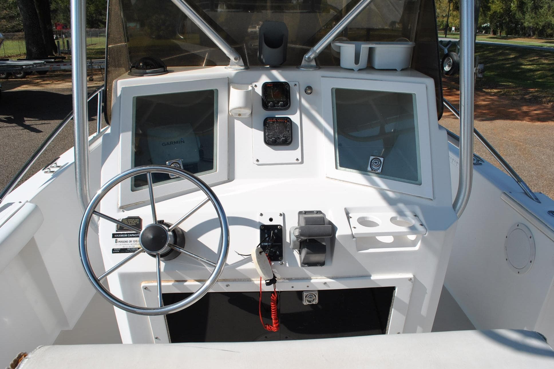 1993 Robalo 2120 Center Console boat dashboard with steering wheel and navigation equipment.