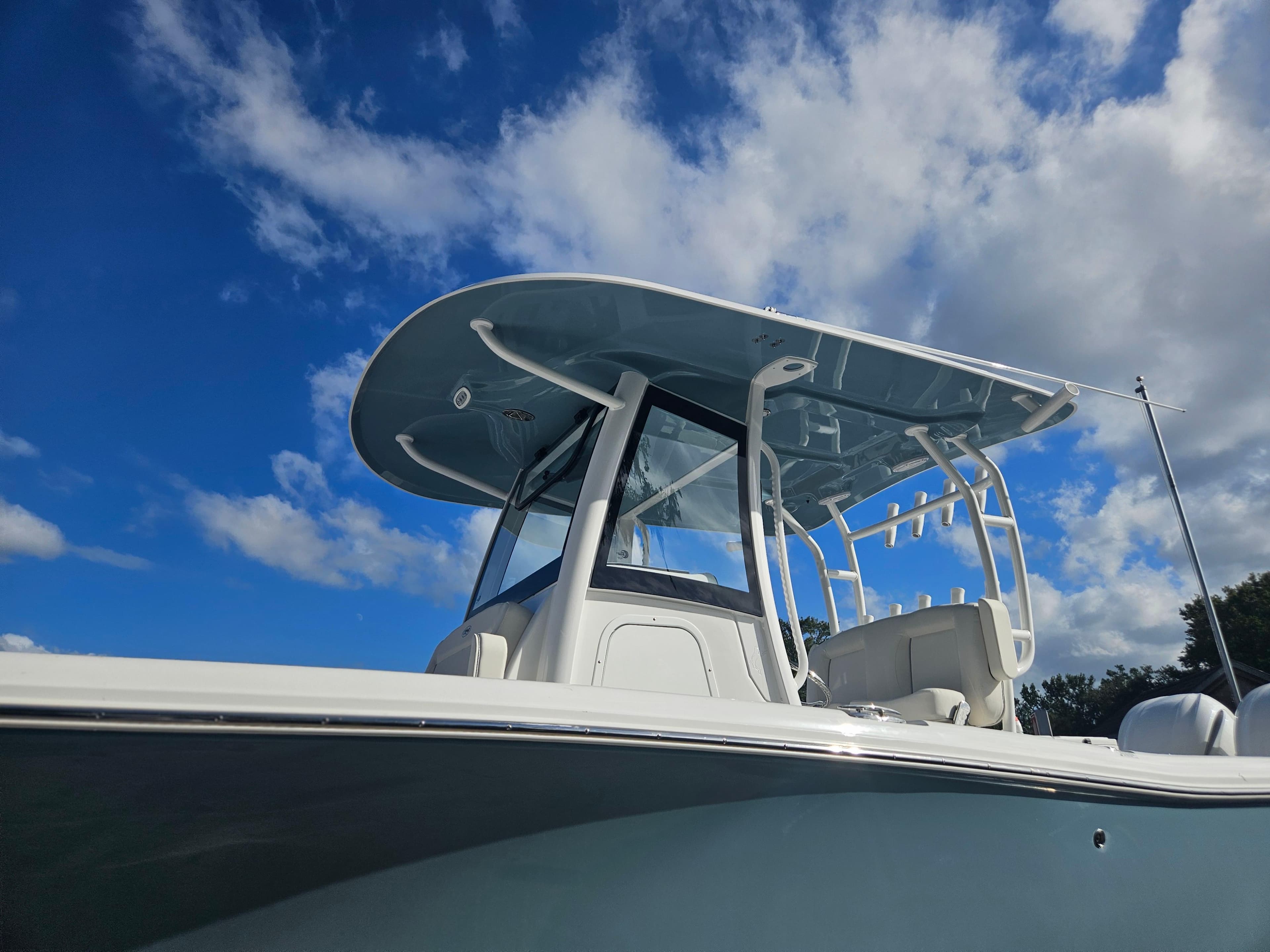 2025 Sea Hunt Gamefish 28 CB boat under a clear blue sky.