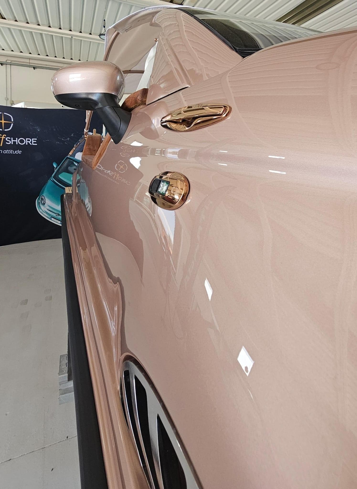 2026 Car Off-shore Fiat 500 in rose gold, showcasing sleek design and luxurious finish.