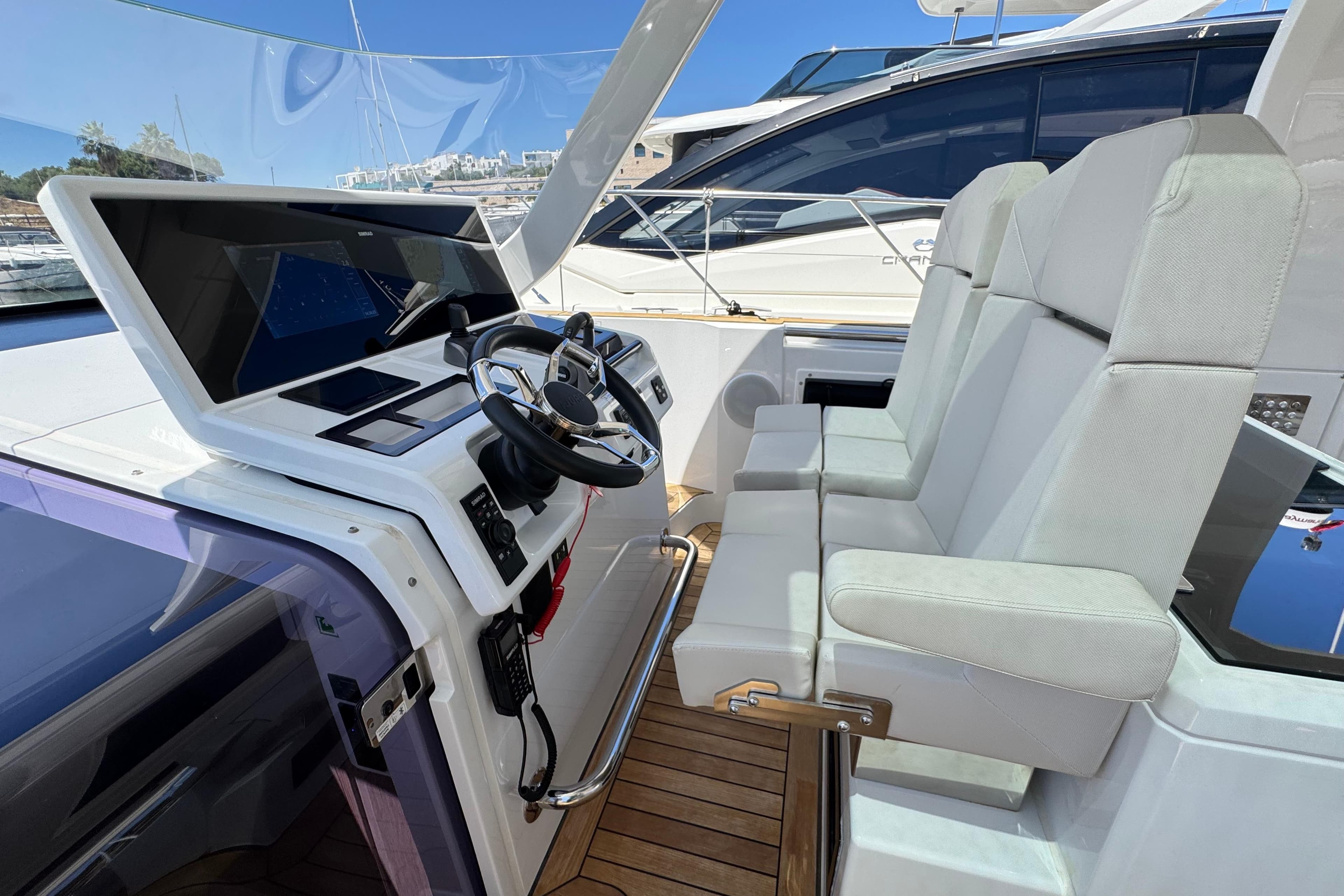 2023 Fjord 41 XL yacht cockpit with modern steering and dual seats.