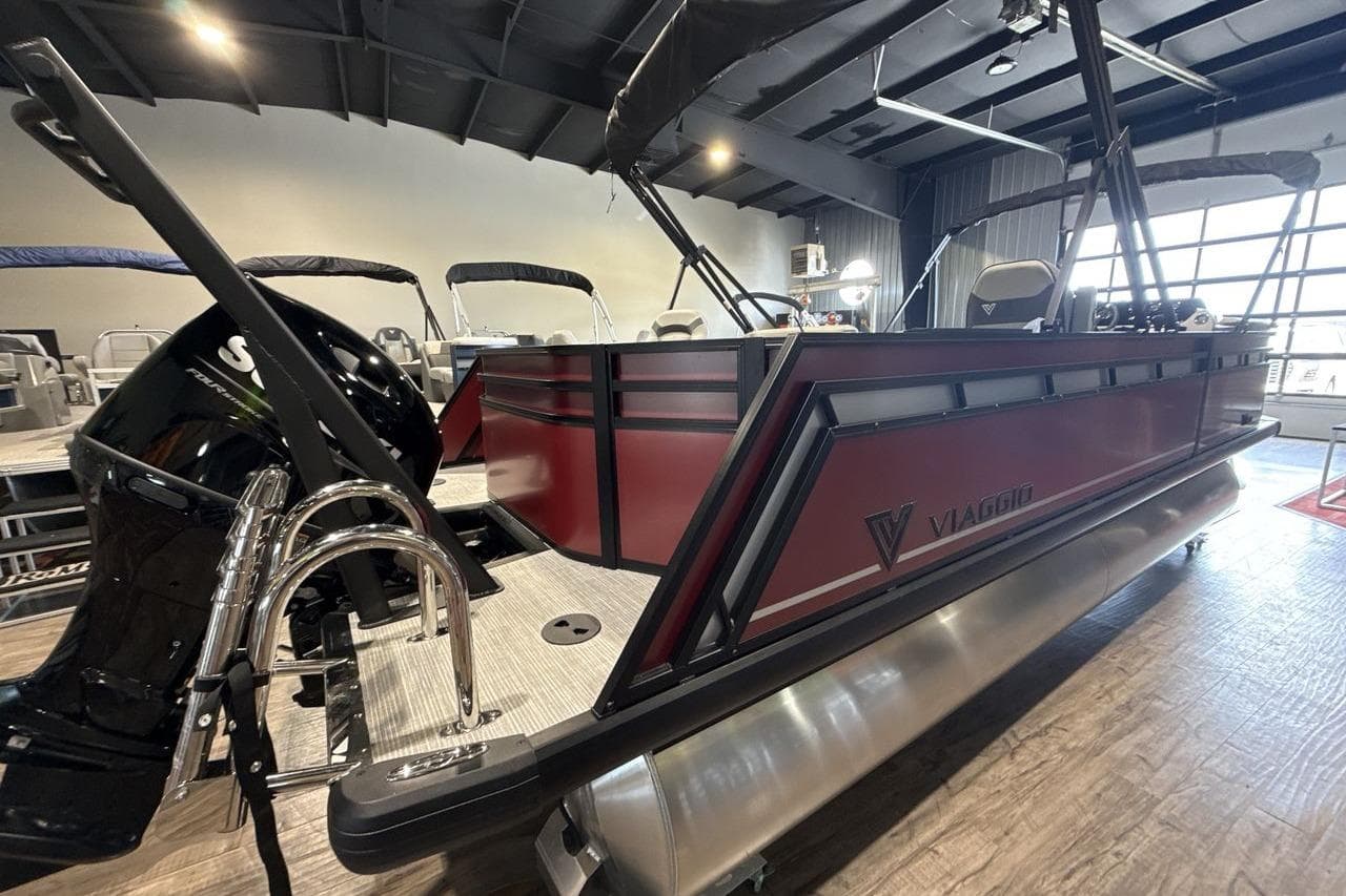 2026 Viaggio V20R pontoon boat with sleek design in showroom setting.