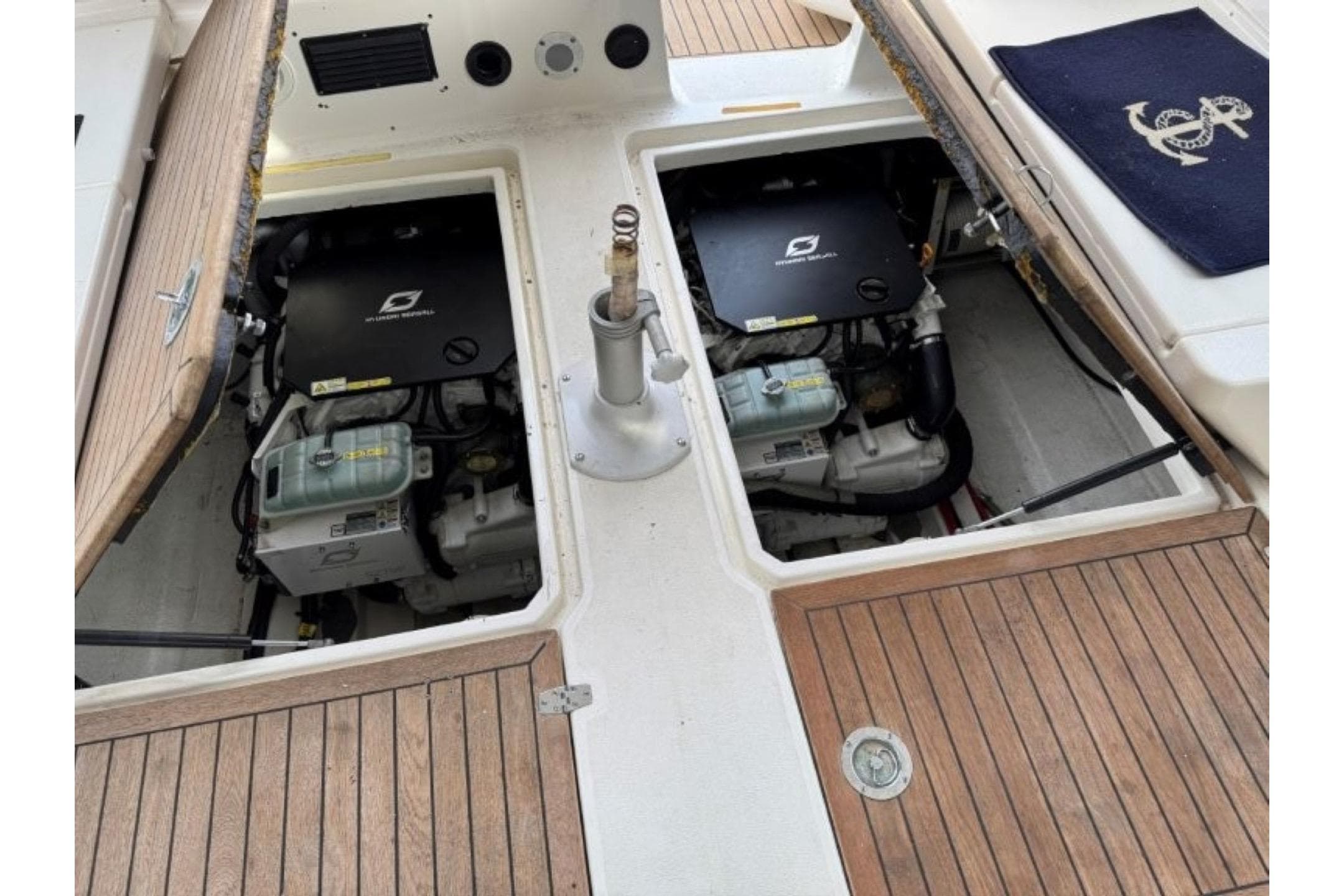 Engine compartment of 1990 Nimbus 35 DC Fly with twin Volvo Penta engines.