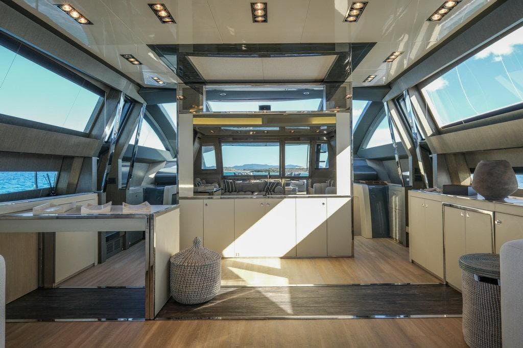 Luxurious interior of 2010 Riva 86' Domino yacht with modern design and panoramic windows.