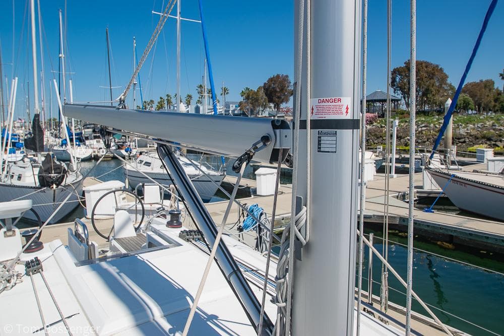 Beneteau Oceanis 30.1 sailboat, 2022 model, docked in a marina under clear blue skies.