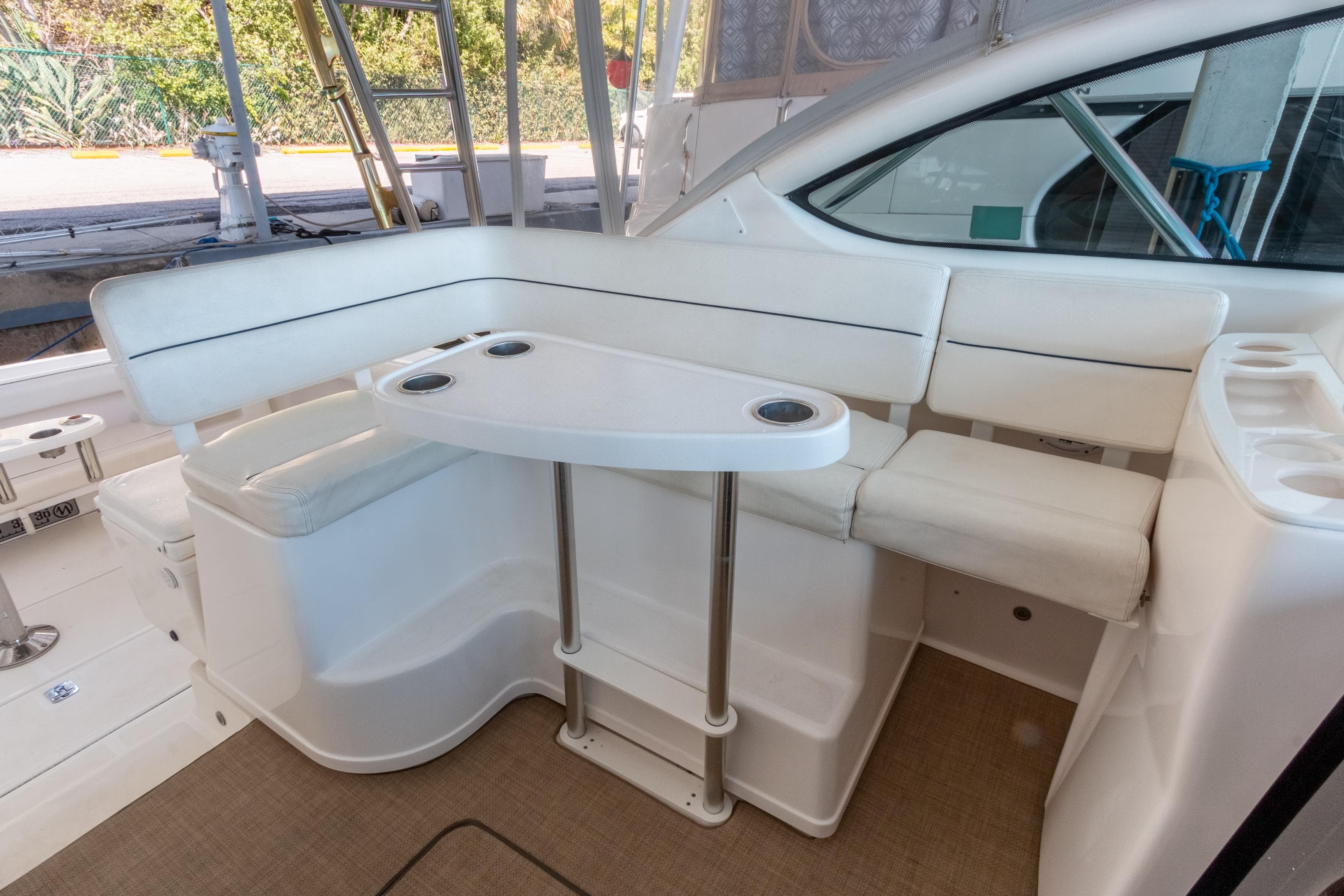 2007 Tiara Yachts 3800 Open interior with white seating and table.