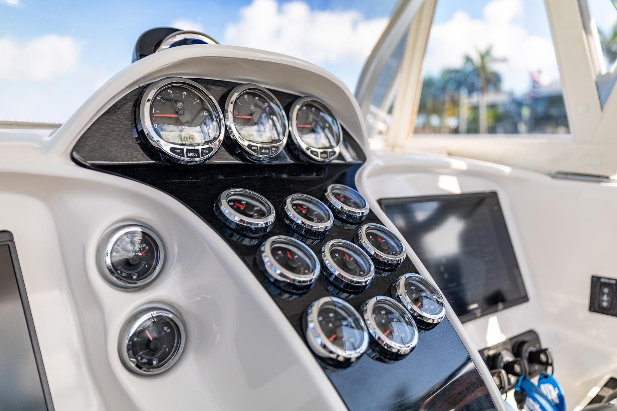 Dashboard of 2019 Deep Impact 369 Sport boat with multiple gauges and controls.