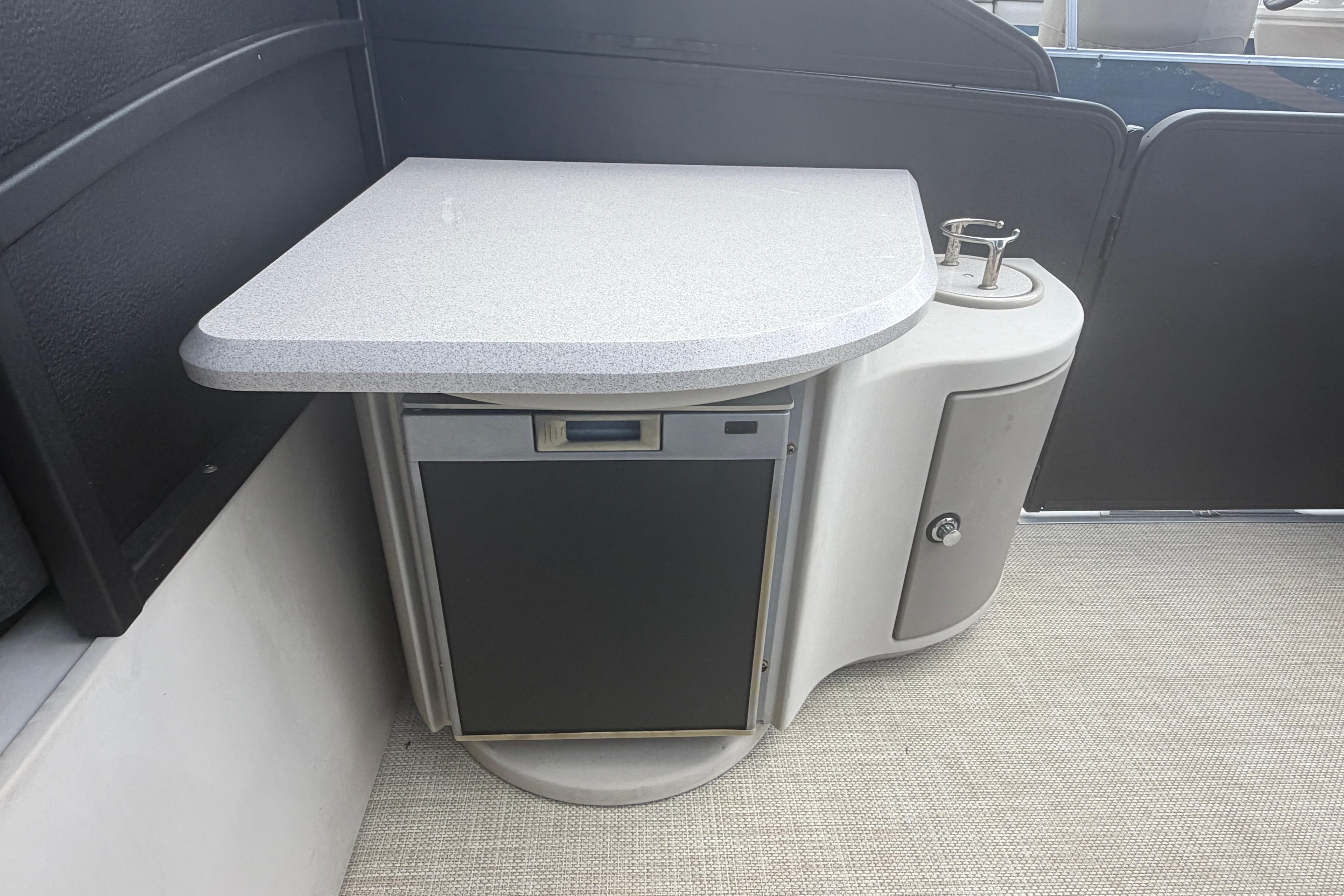 2015 Premier 290 Grand View boat interior with countertop and storage cabinet.