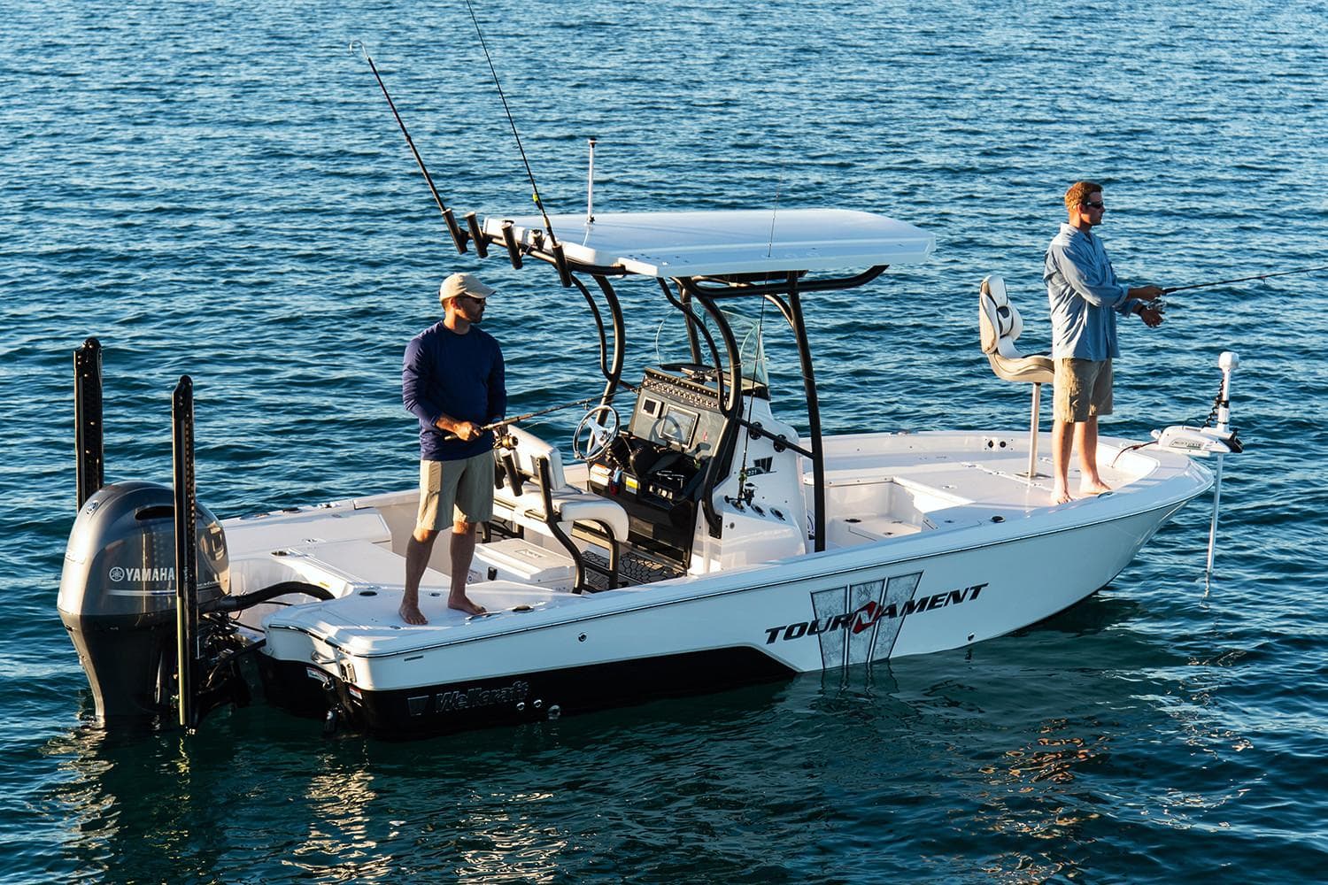 Manufacturer Provided Image: 2019 Wellcraft 221 Bay boat with two people fishing on calm water.