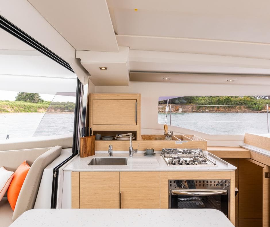 Modern kitchen interior of 2025 Fountaine Pajot NEW 41 yacht with ocean view.