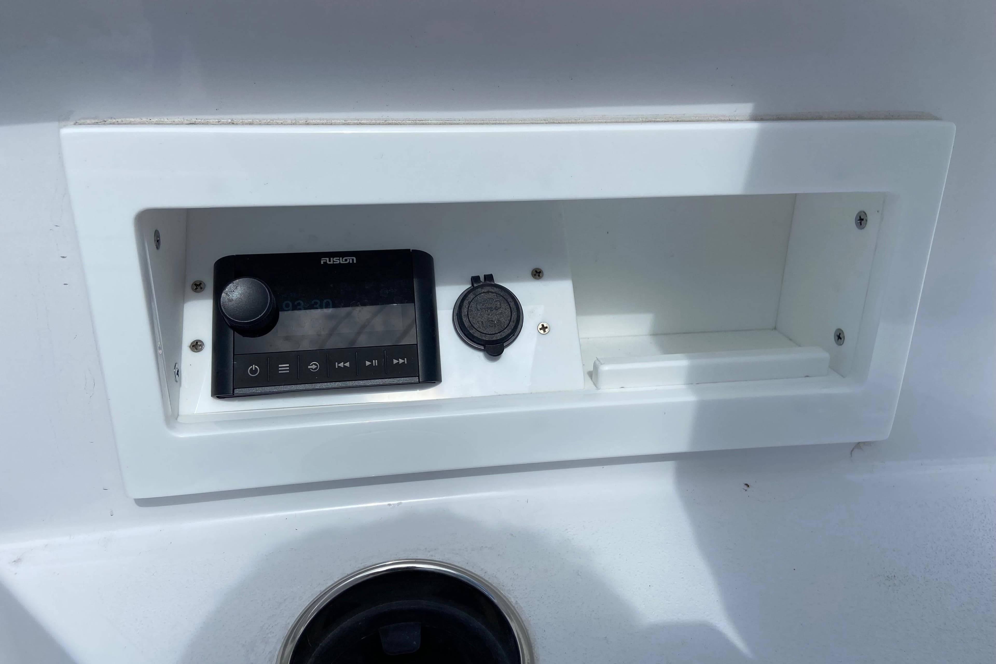 Control panel on 2026 Sportsman Heritage 321 Center Console boat, featuring Fusion audio system.