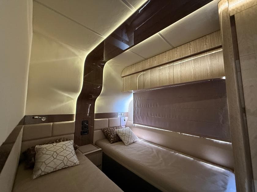 Luxurious interior cabin of 2021 Galeon 700 Sky yacht with modern design and ambient lighting.