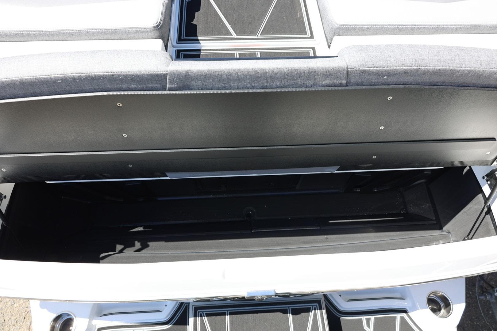 2026 Tigé Z3 boat storage compartment with open lid, showcasing spacious interior.